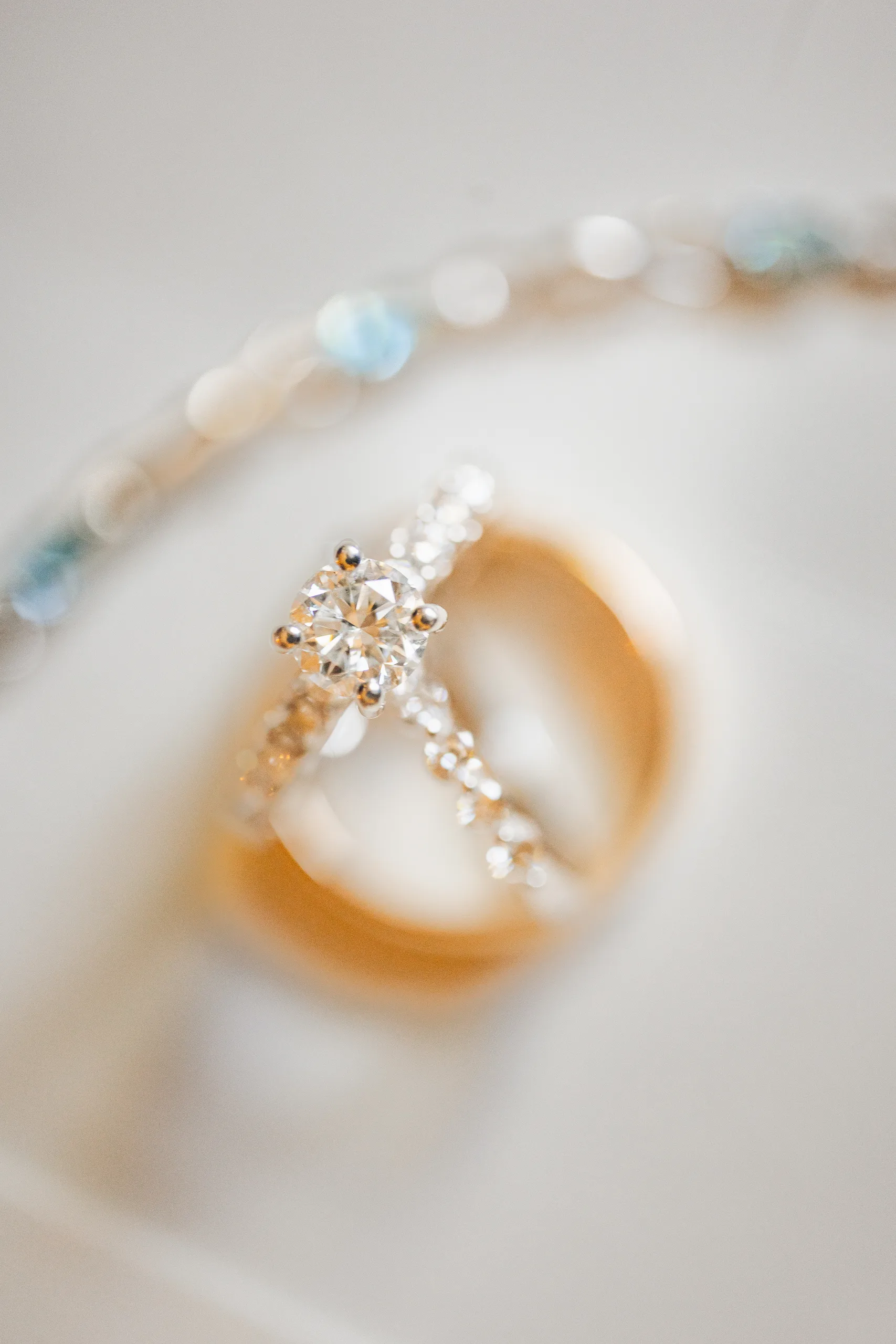 Wedding Details: her engagement ring and gold band at a wedding at Ivy Hall at Roswell Mill in Roswell, GA