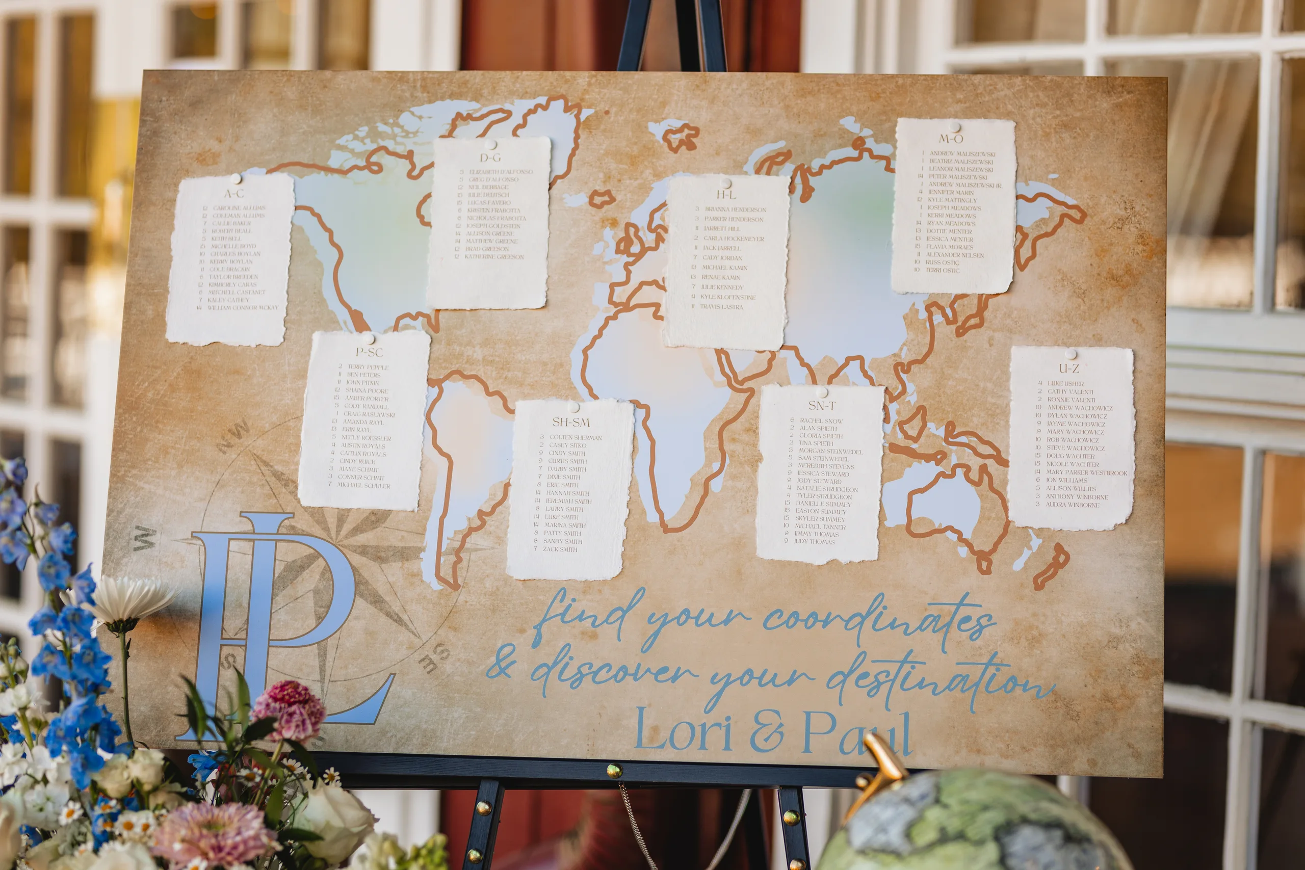 Reception Details: the map seating chart reading find your coordinates and discover your destination at a wedding at Ivy Hall at Roswell Mill in Roswell, GA