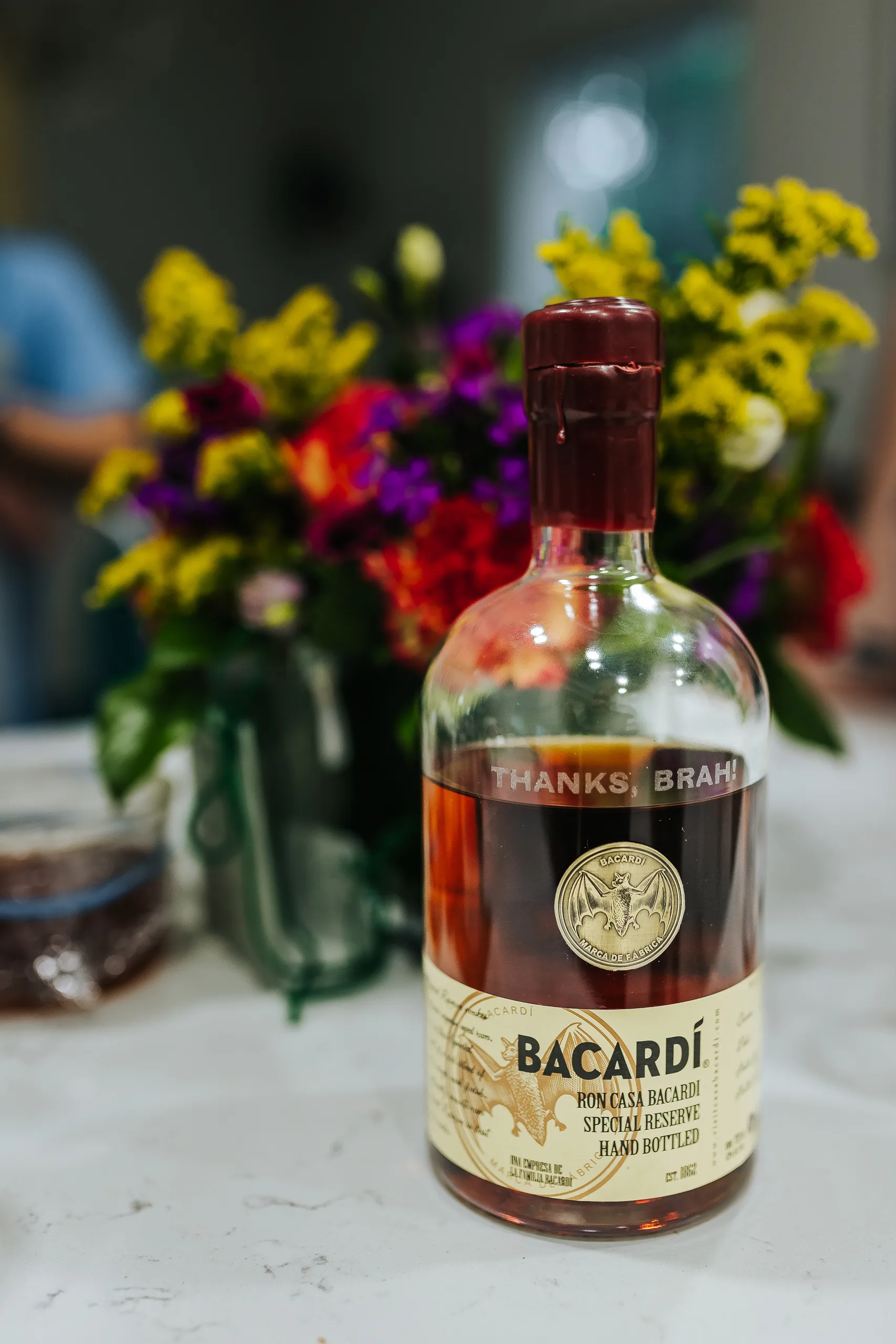Wedding Details: a Bacardi bottle labeled Thanks, Brah for the groomsmen, at a wedding at Terminus 330 in Atlanta, GA