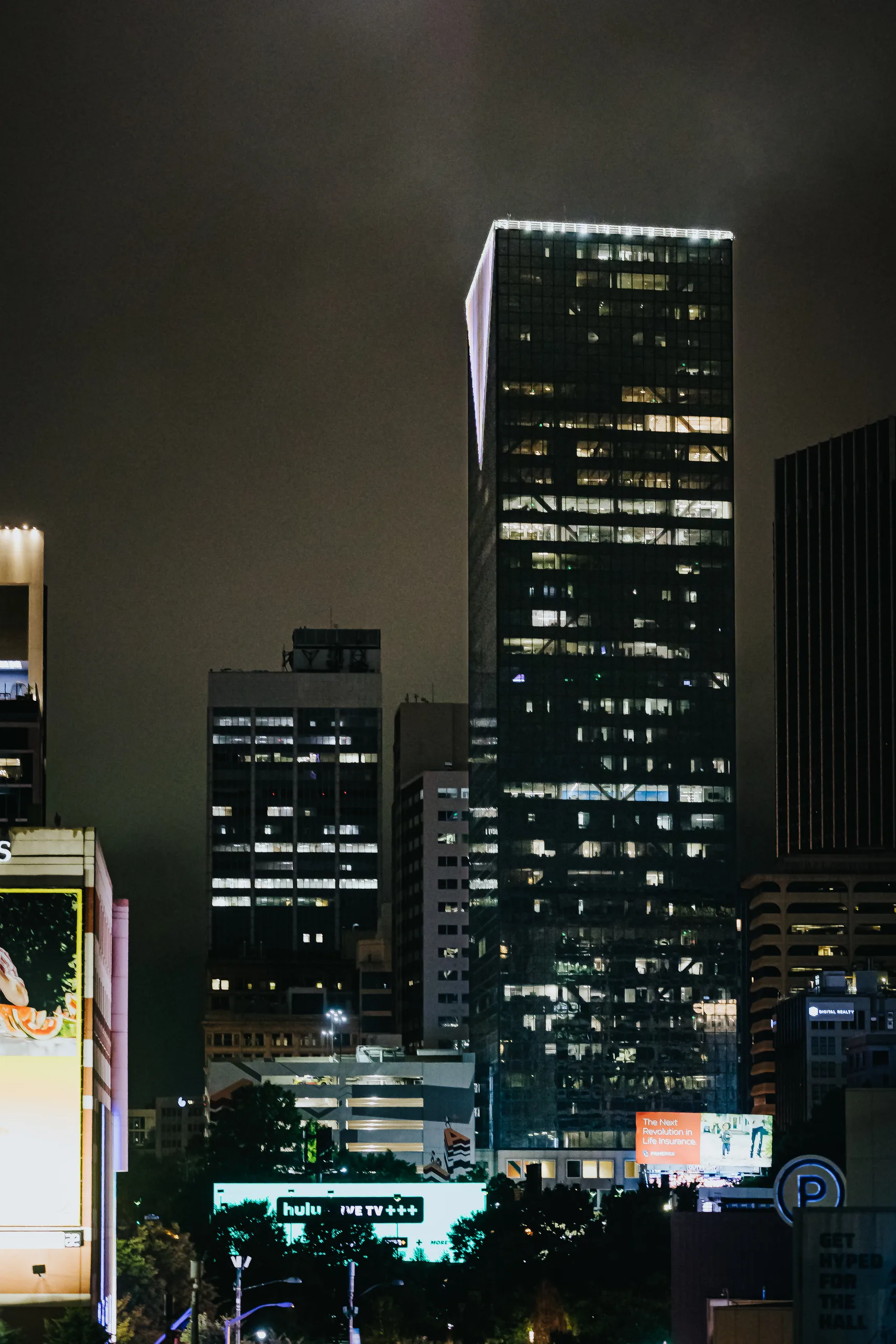 Reception Details: a downtown tower lit up at night, at a wedding at Terminus 330 in Atlanta, GA