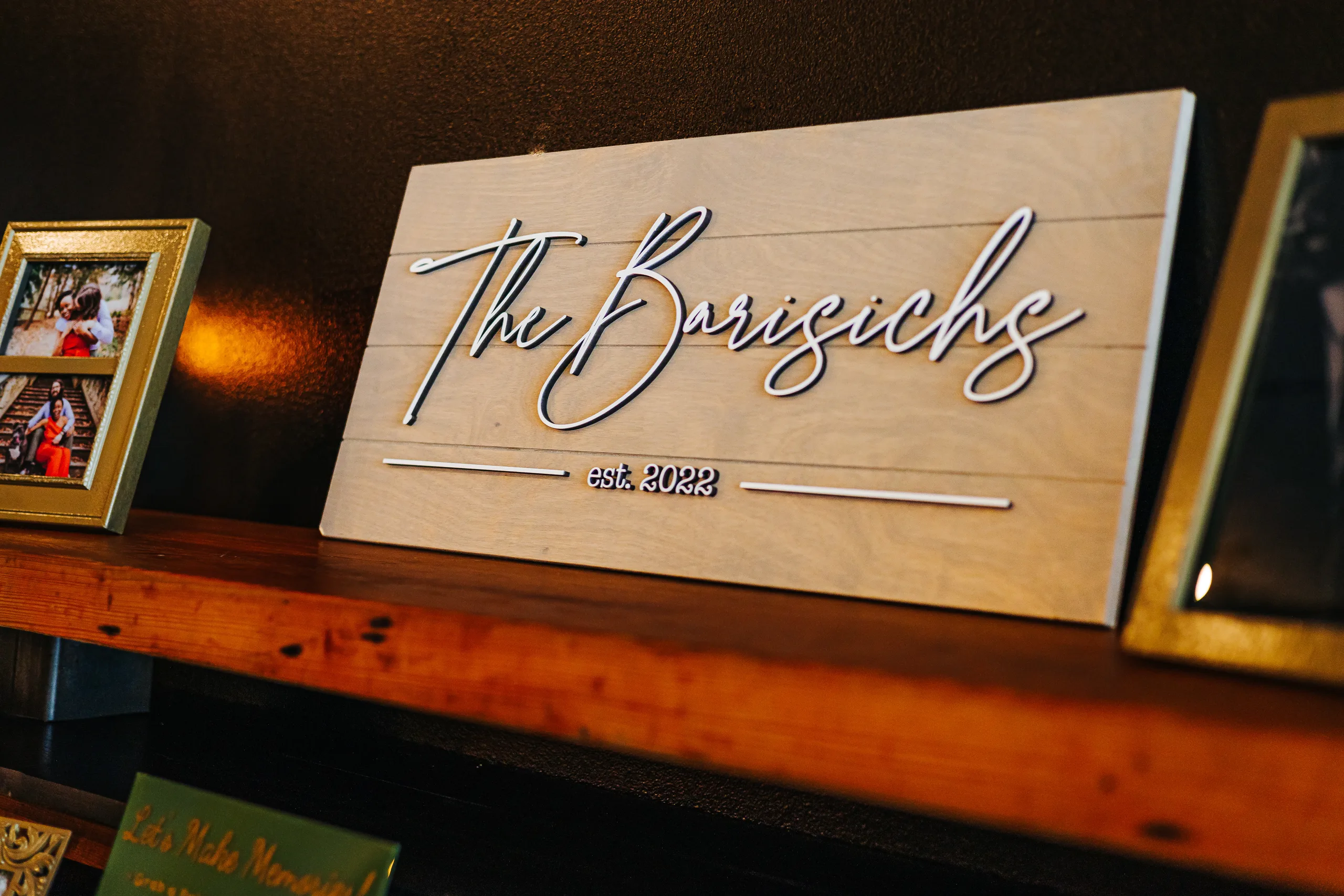 Reception Details: a wooden The Borisichs sign on a shelf, at a wedding at Terminus 330 in Atlanta, GA