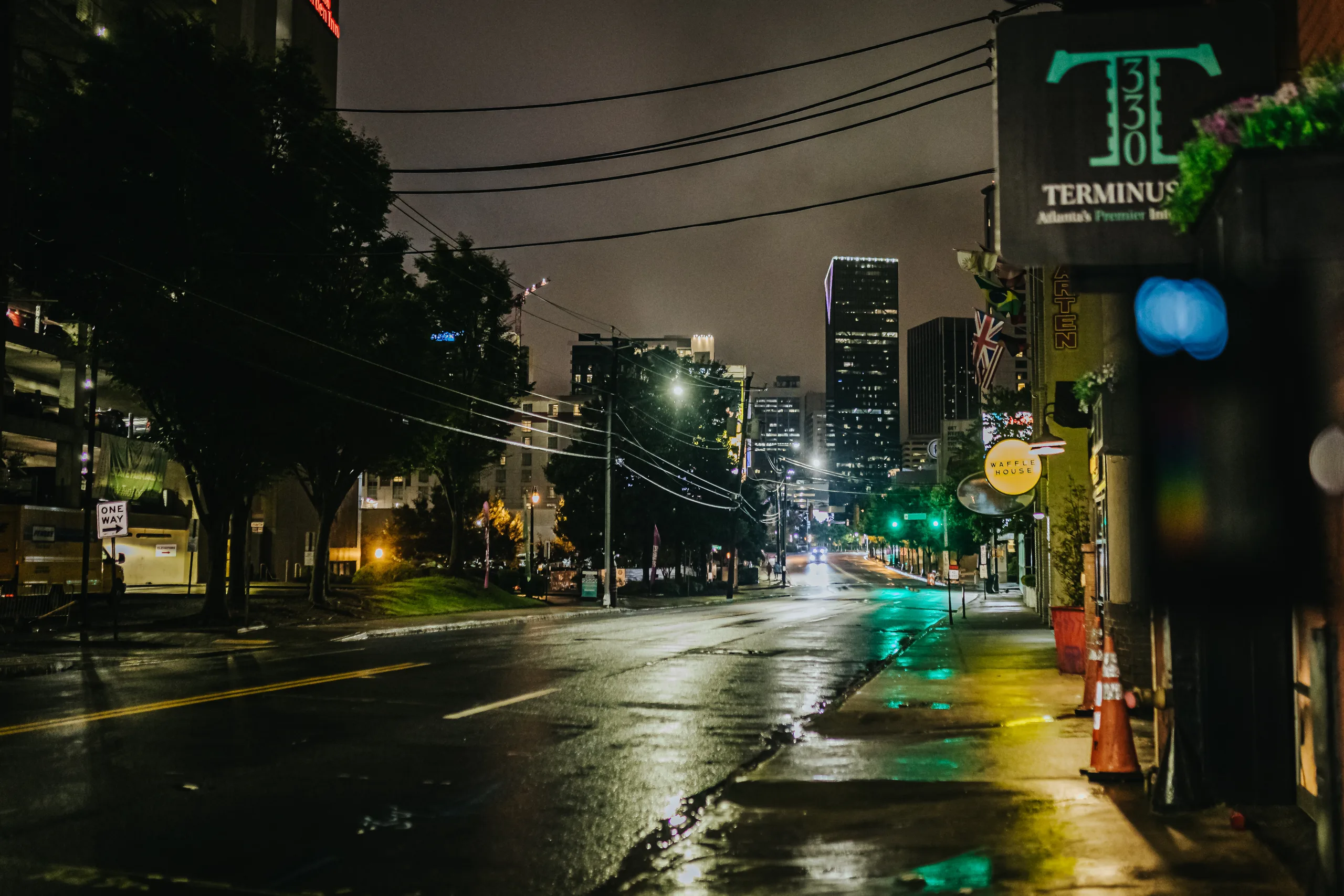 Reception Details: the Terminus 330 sign on the wet street at night, at a wedding at Terminus 330 in Atlanta, GA