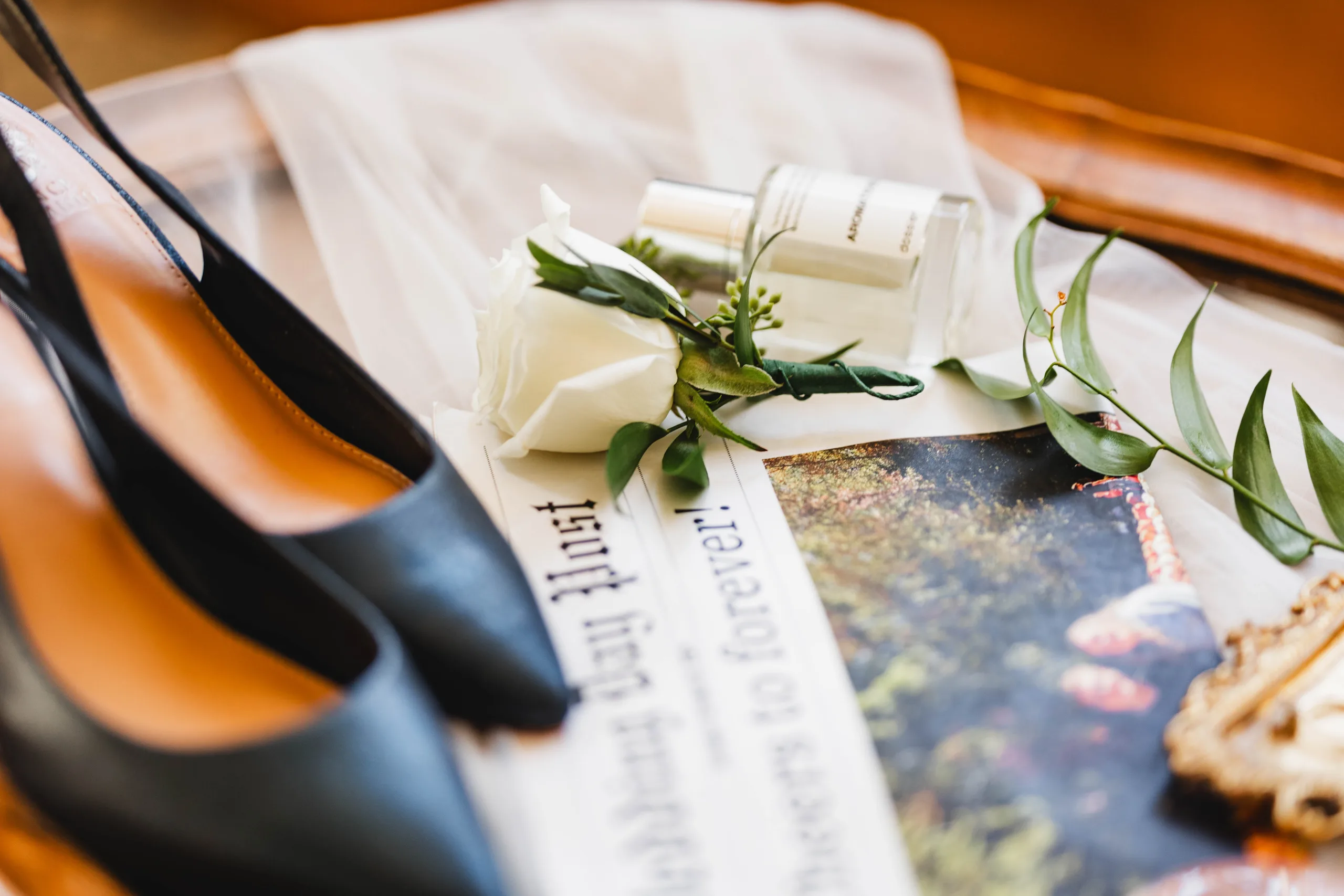 Wedding Details: her navy heels, his boutonniere and her perfume on the veil, at a wedding at Naylor Hall in Roswell, GA