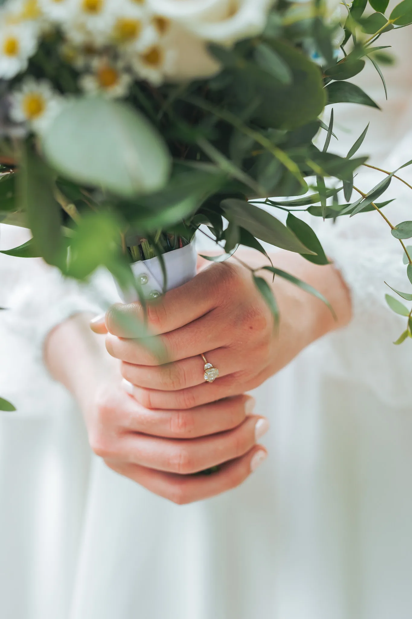 Wedding Details: her hands and ring on her bouquet, at a wedding at Cator Woolford Gardens in Atlanta, GA