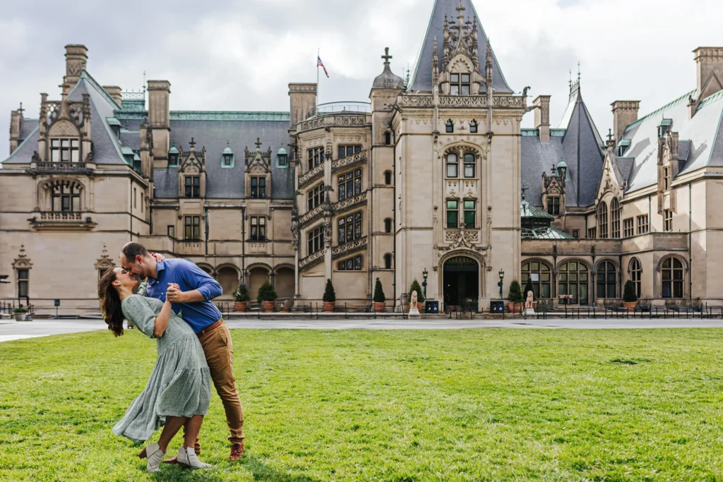 Front Lawn: a dip on the lawn in front of Biltmore House, at their engagement session at Biltmore Estate in Asheville, NC