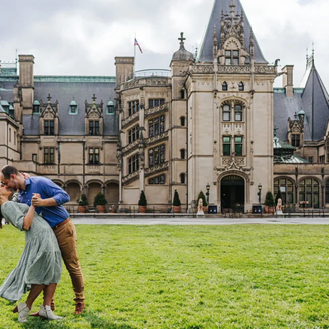 Front Lawn: a dip on the lawn in front of Biltmore House, at their engagement session at Biltmore Estate in Asheville, NC