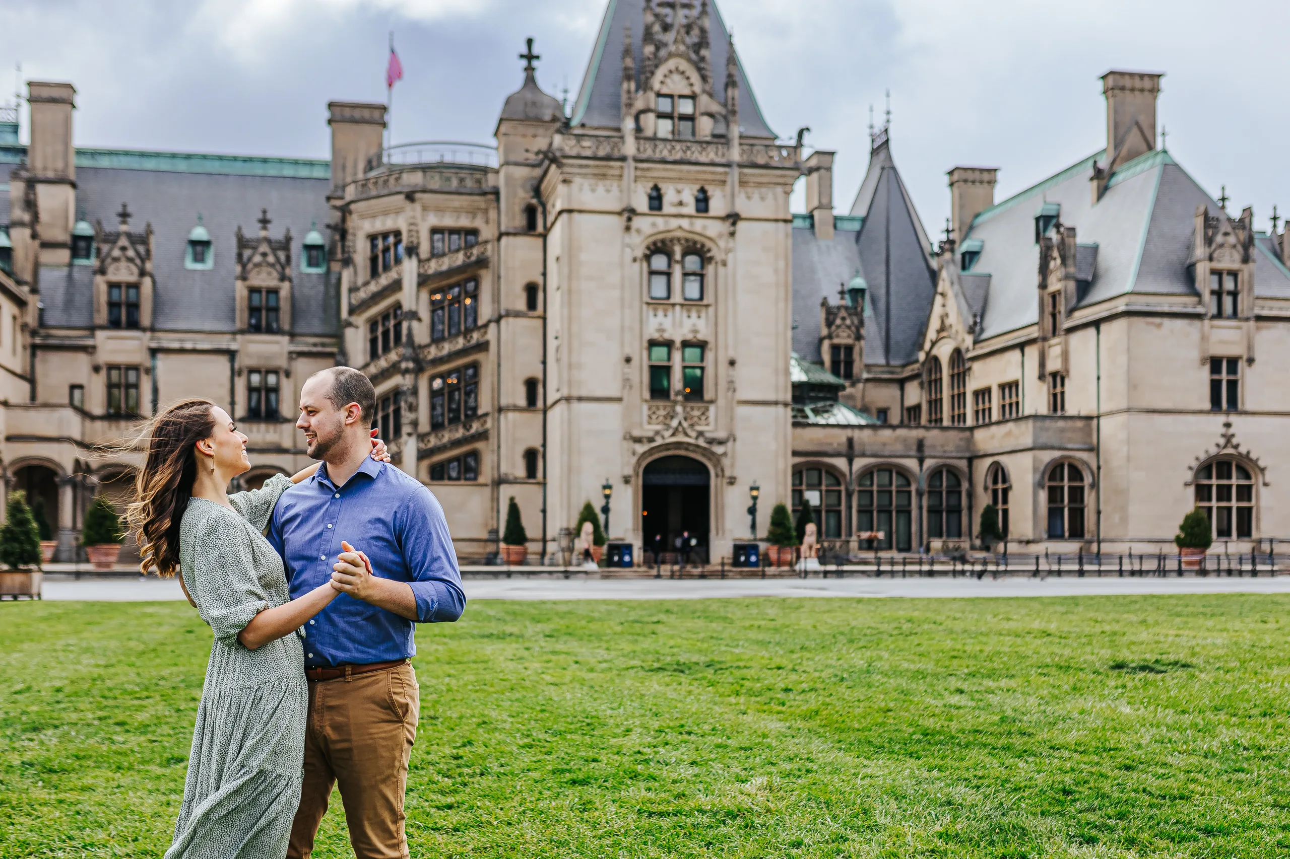 Front Lawn: dancing on the lawn in front of Biltmore House, at their engagement session at Biltmore Estate in Asheville, NC
