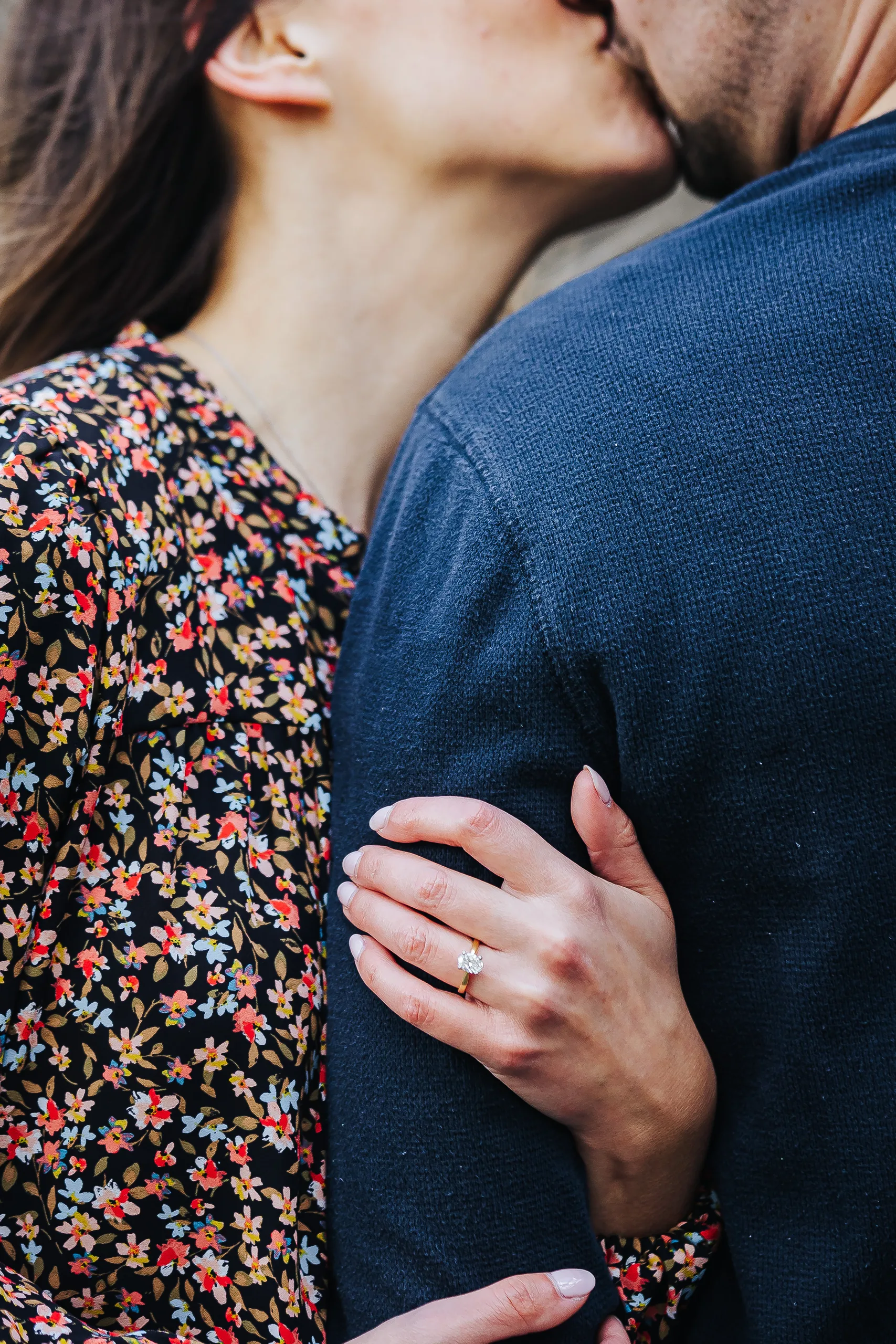 Engagement Ring: her ring on his sleeve as he kisses her, at their engagement session at Biltmore Estate in Asheville, NC