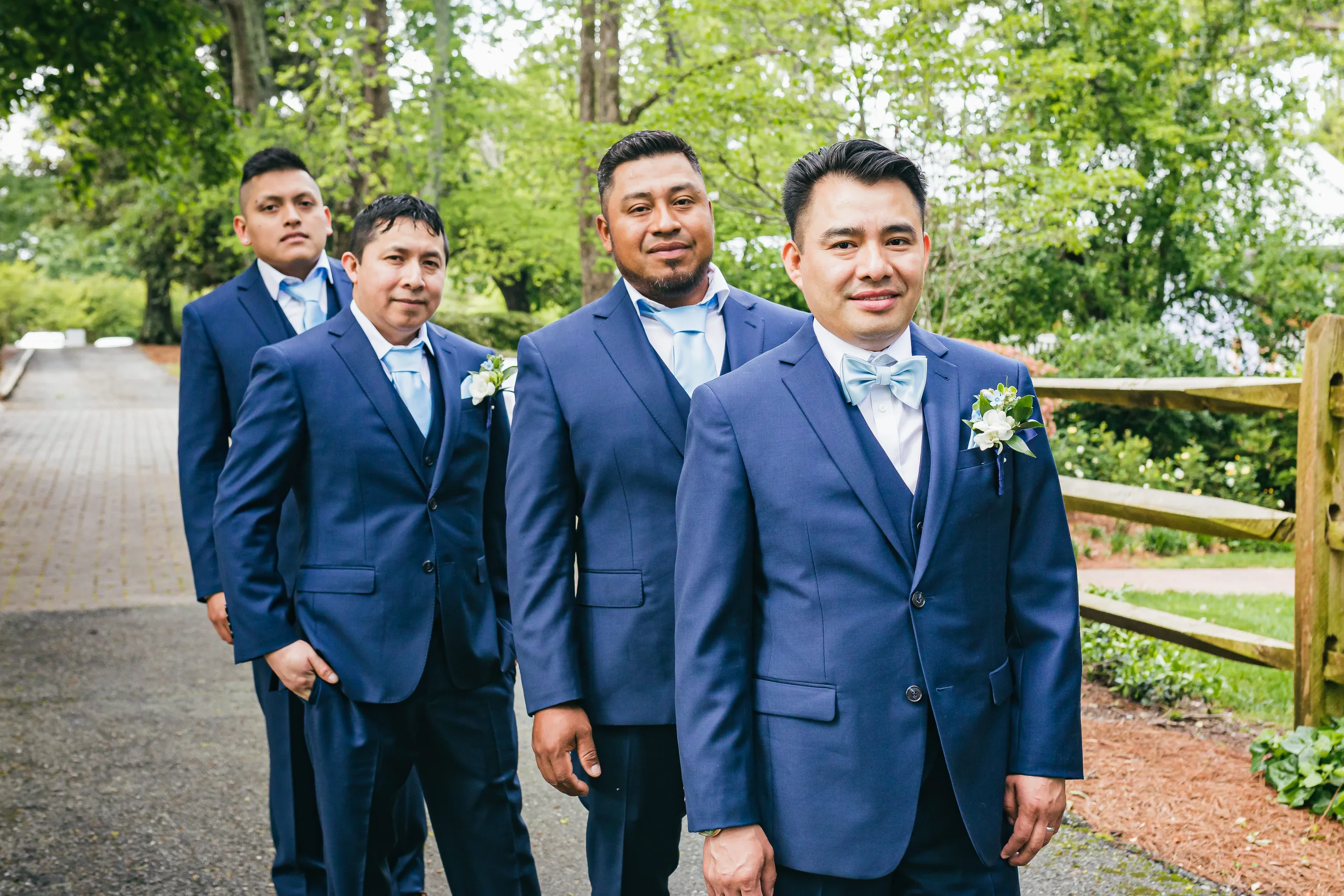 Wedding Party: the groom with his groomsmen in navy suits at their wedding at the Payne-Corley House in Duluth, GA