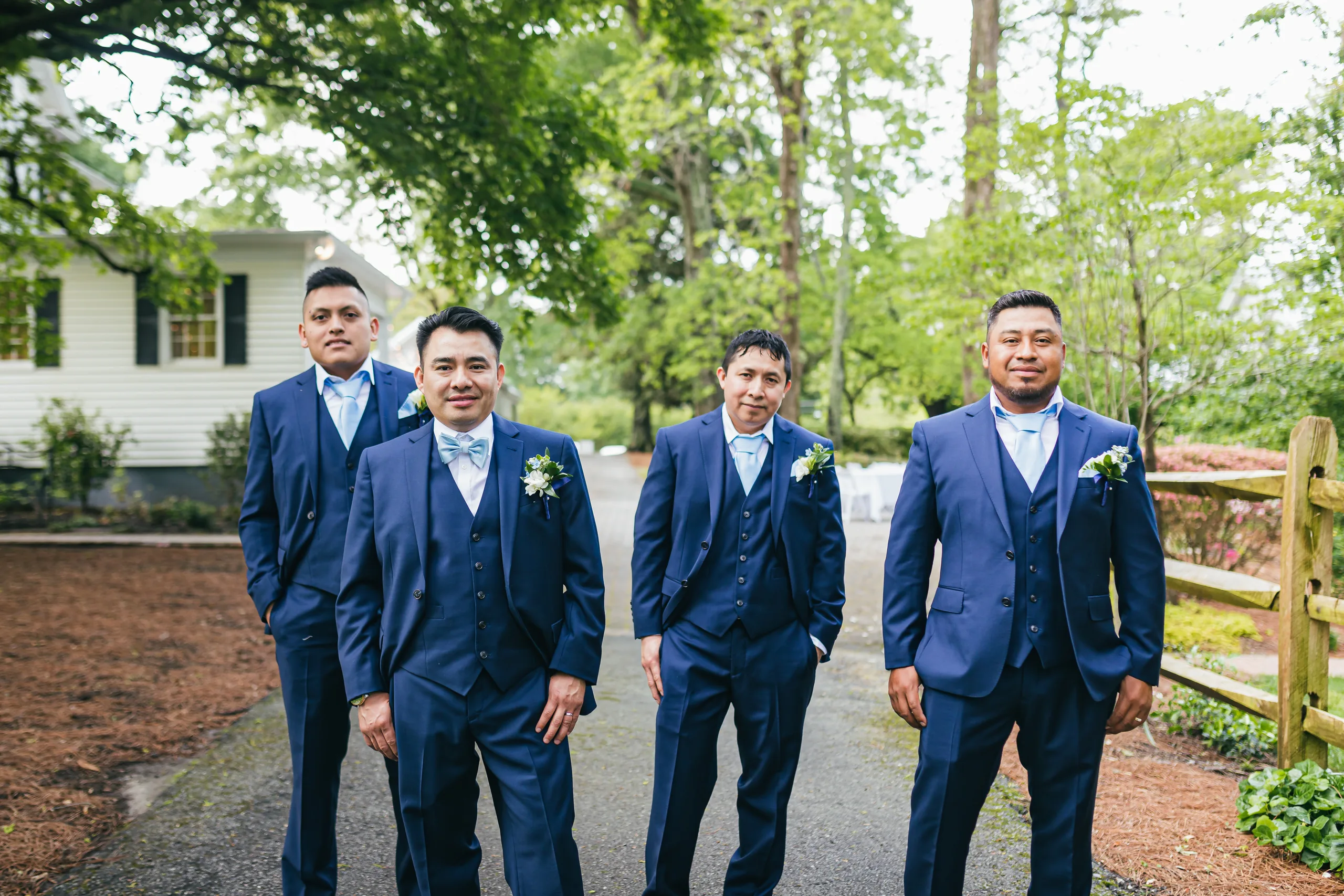 Wedding Party: the groomsmen on the drive with the house behind them at their wedding at the Payne-Corley House in Duluth, GA