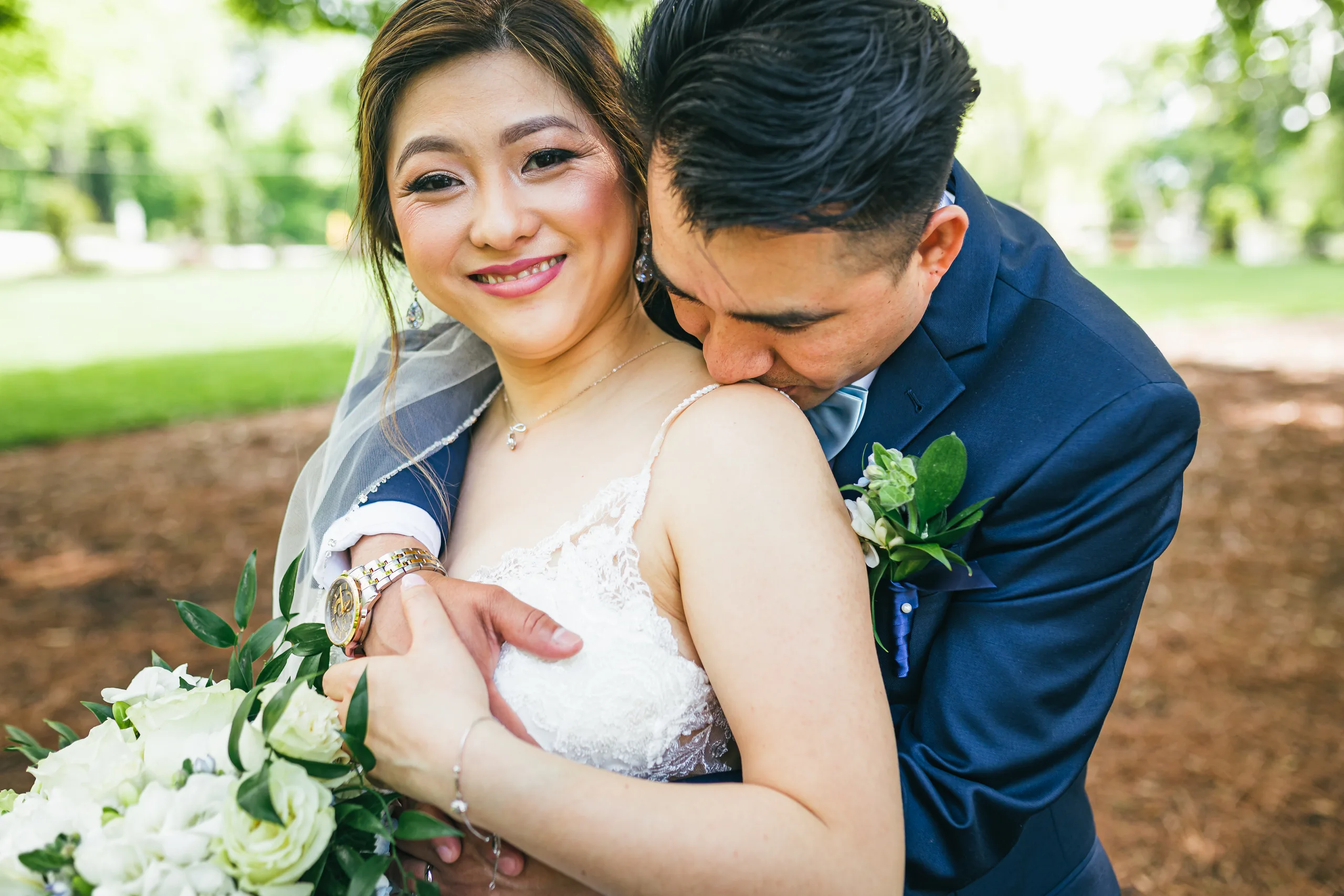 Wedding Formals: the groom hugging her from behind at their wedding at the Payne-Corley House in Duluth, GA