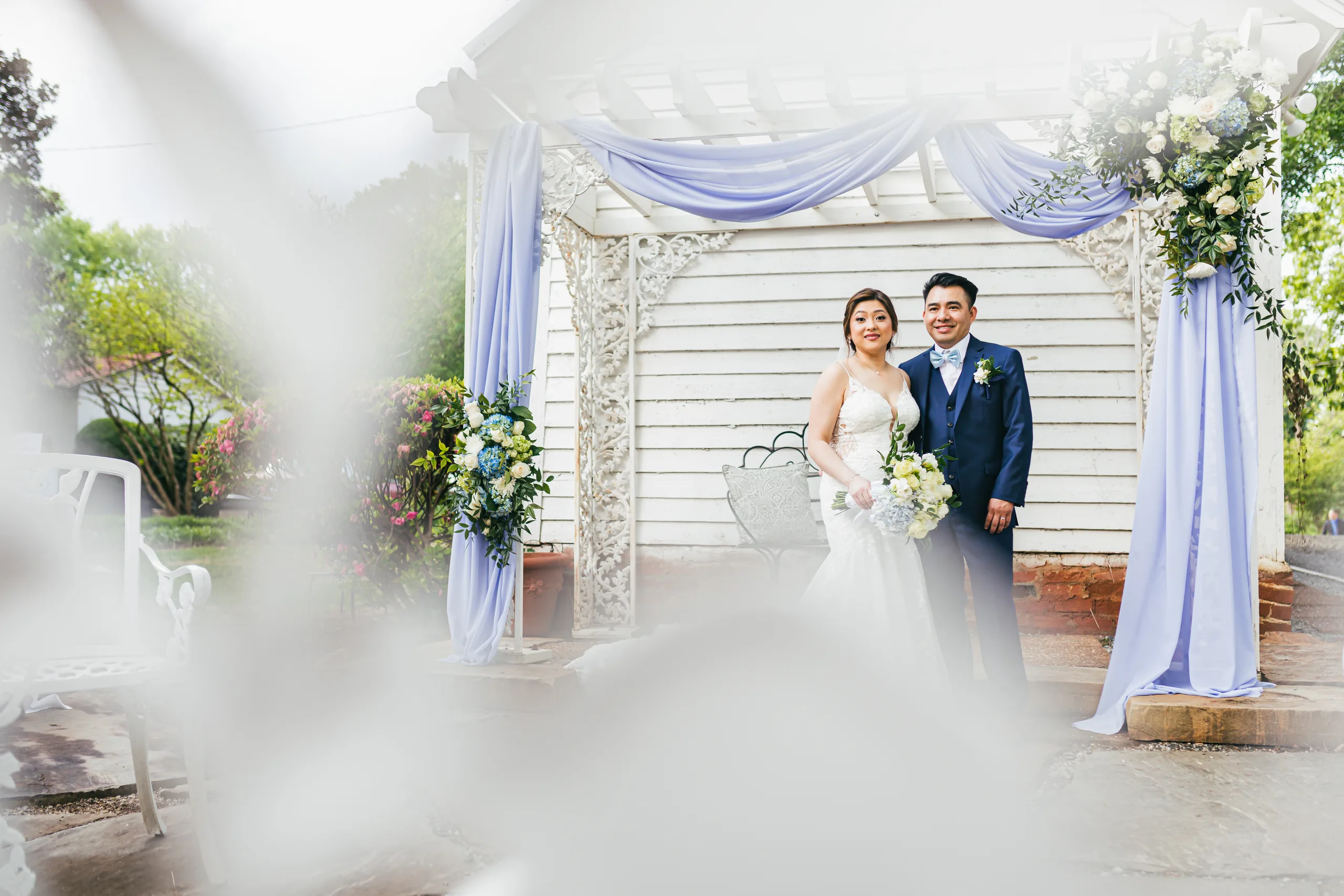 Wedding Formals: the couple under the draped arch at their wedding at the Payne-Corley House in Duluth, GA