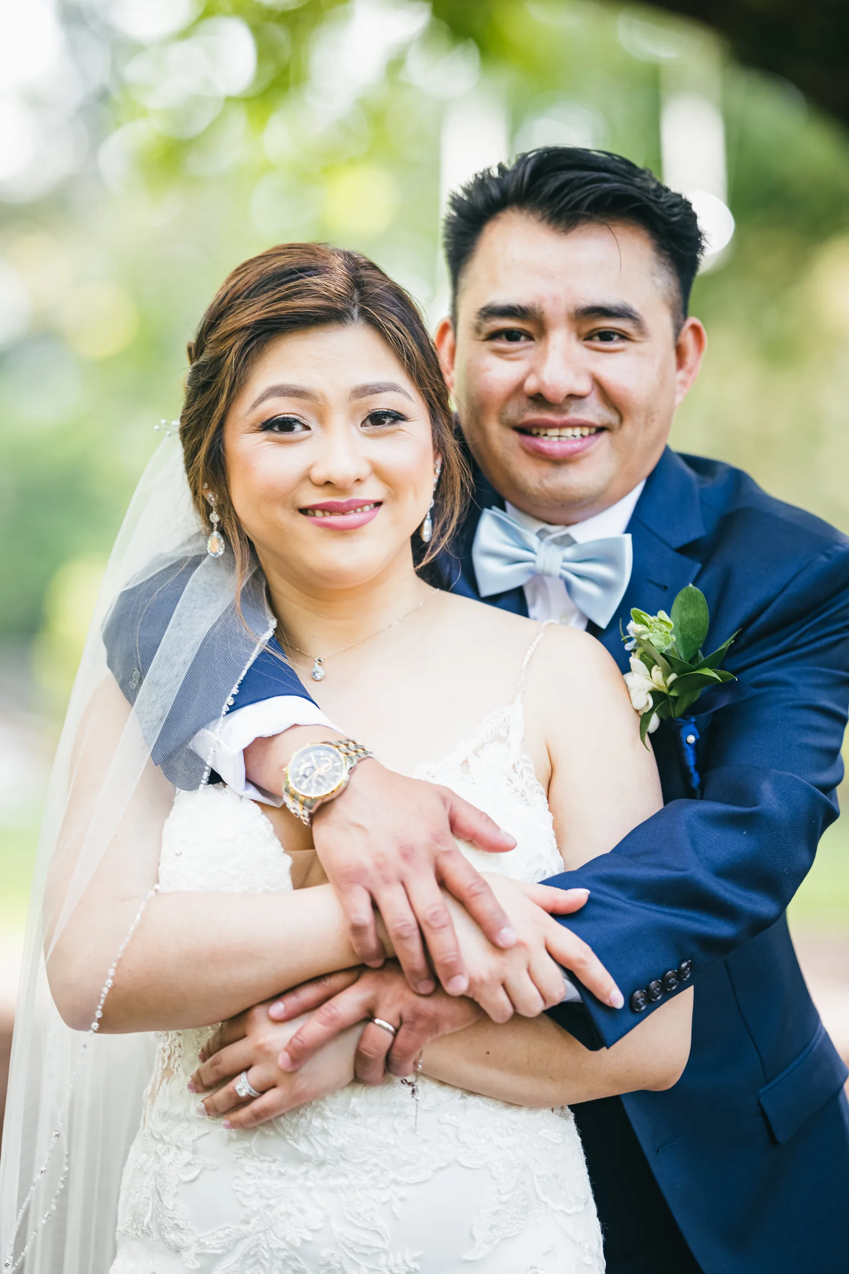 Wedding Formals: smiling together with his arms around her at their wedding at the Payne-Corley House in Duluth, GA
