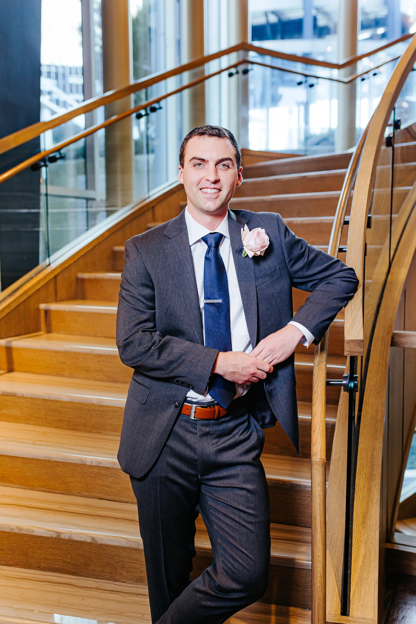 Wedding Formals: the groom on the staircase at their wedding at the Omni Hotel at The Battery in Atlanta, GA