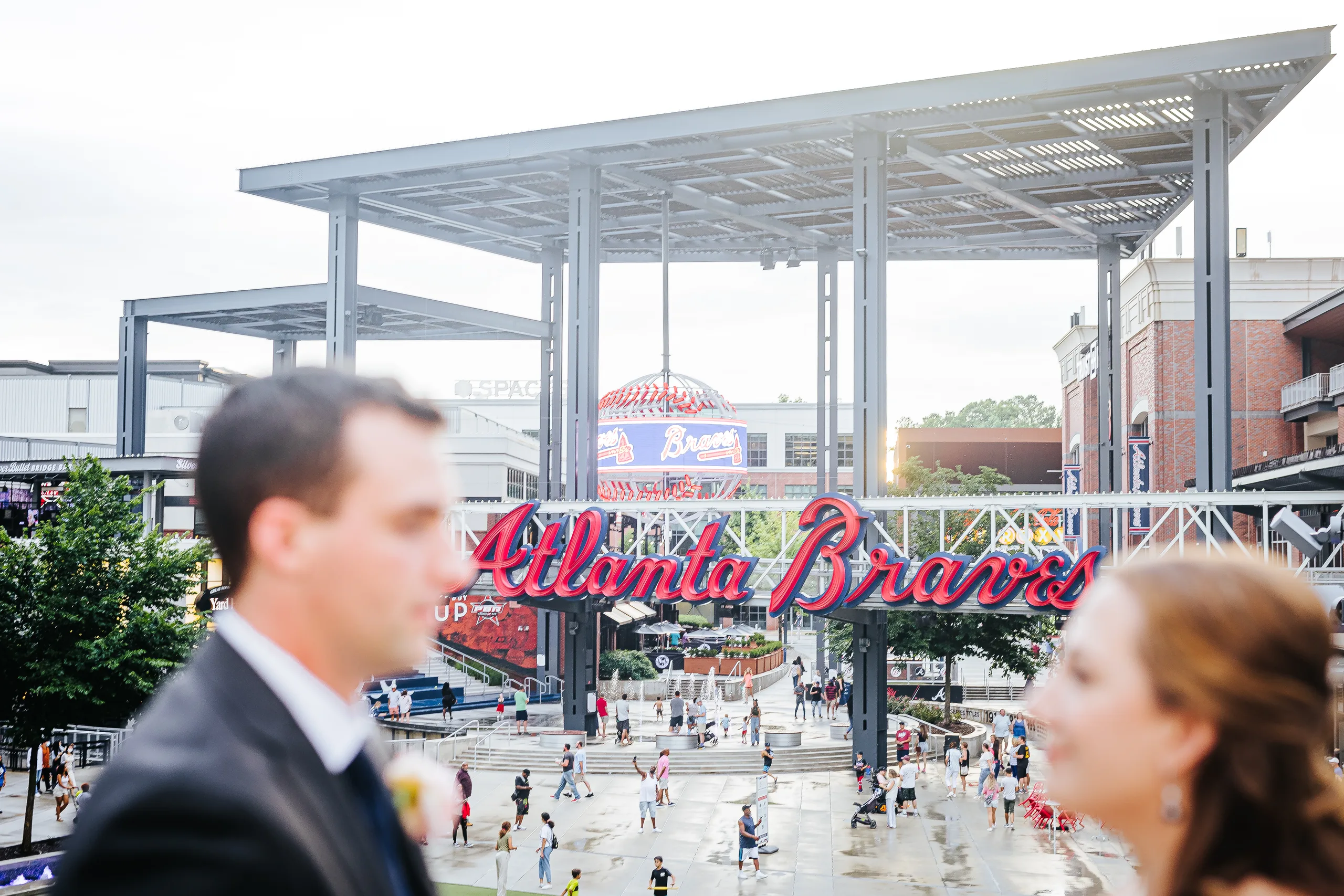 Wedding Formals: the Atlanta Braves sign at The Battery behind the couple at their wedding at the Omni Hotel at The Battery in Atlanta, GA
