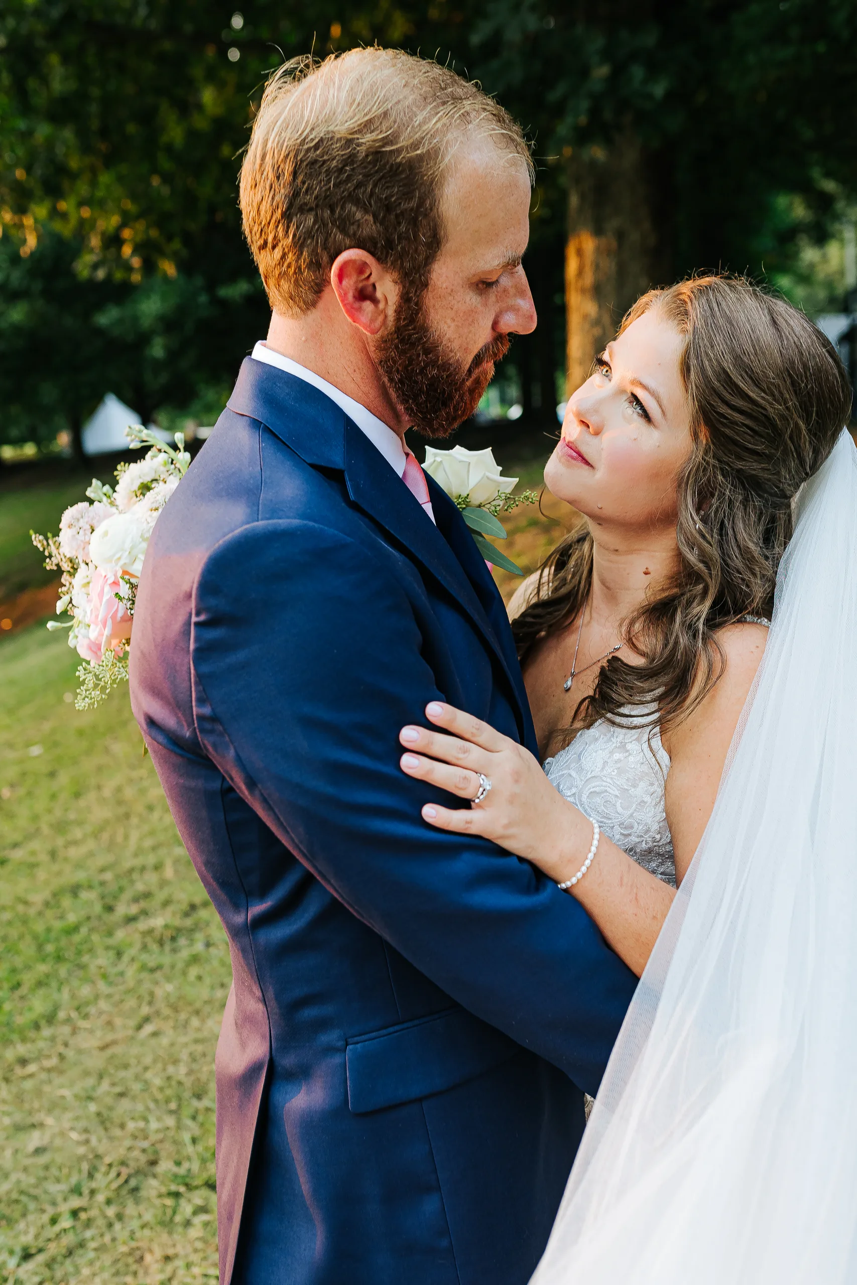 Wedding Formals: an embrace under the trees, at their wedding at The Piedmont Room in Atlanta, GA