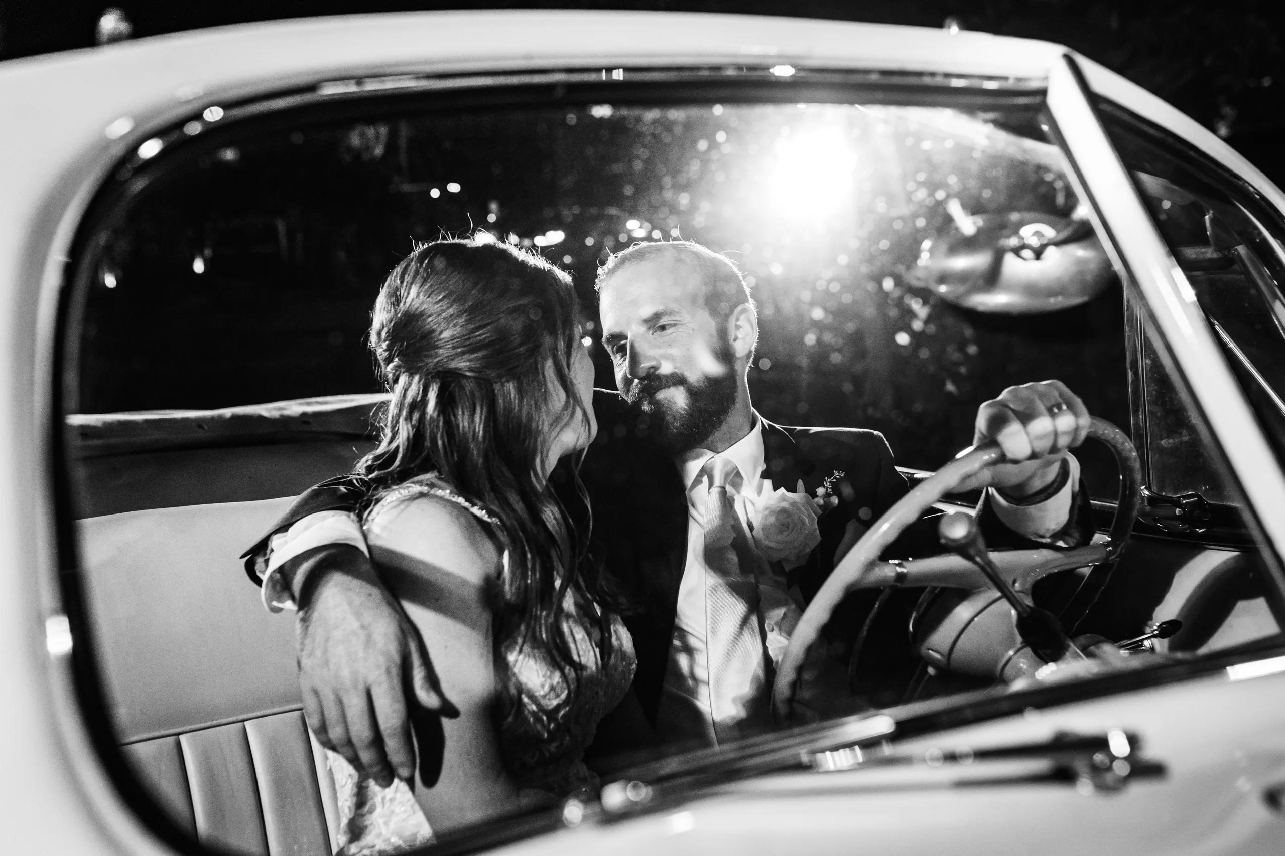 Wedding Formals: in the vintage Packard convertible, in black and white, at their wedding at The Piedmont Room in Atlanta, GA