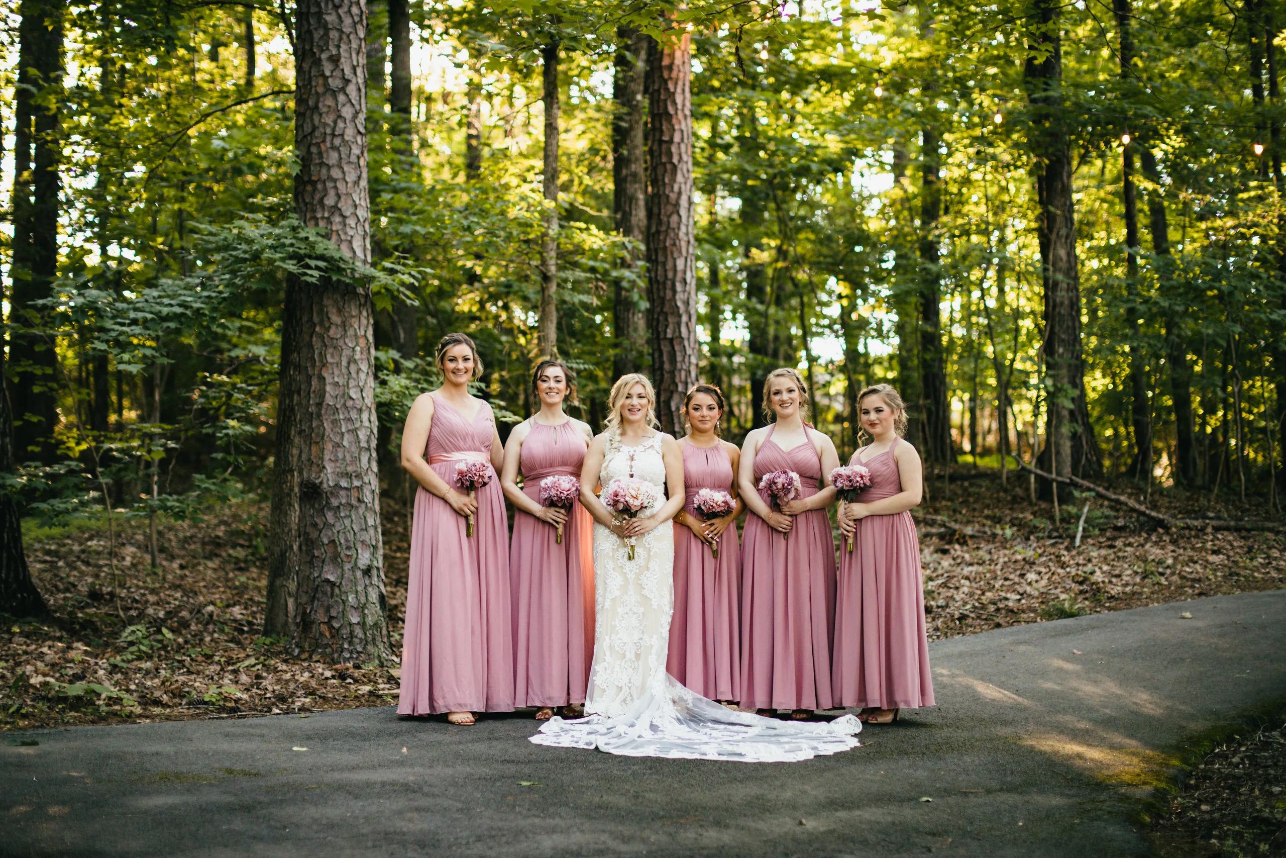 Wedding Party: the bride and her bridesmaids in the woods, at their wedding at Atlanta Evergreen Lakeside Resort in Stone Mountain, GA