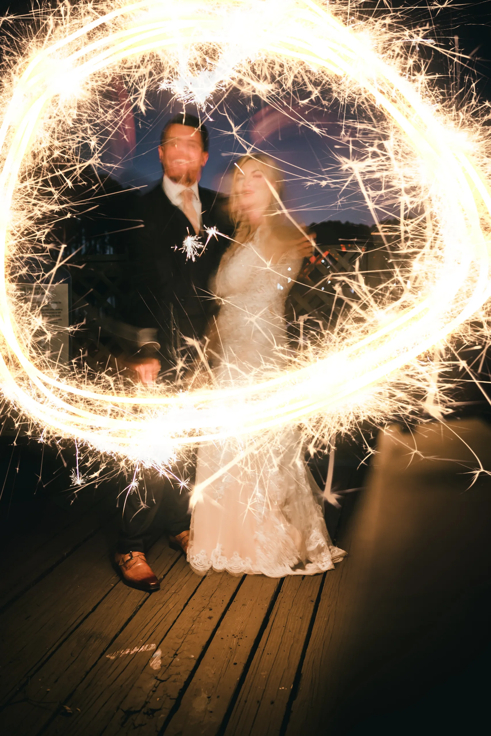 Wedding Formals: framed in a sparkler circle on the dock, at their wedding at Atlanta Evergreen Lakeside Resort in Stone Mountain, GA