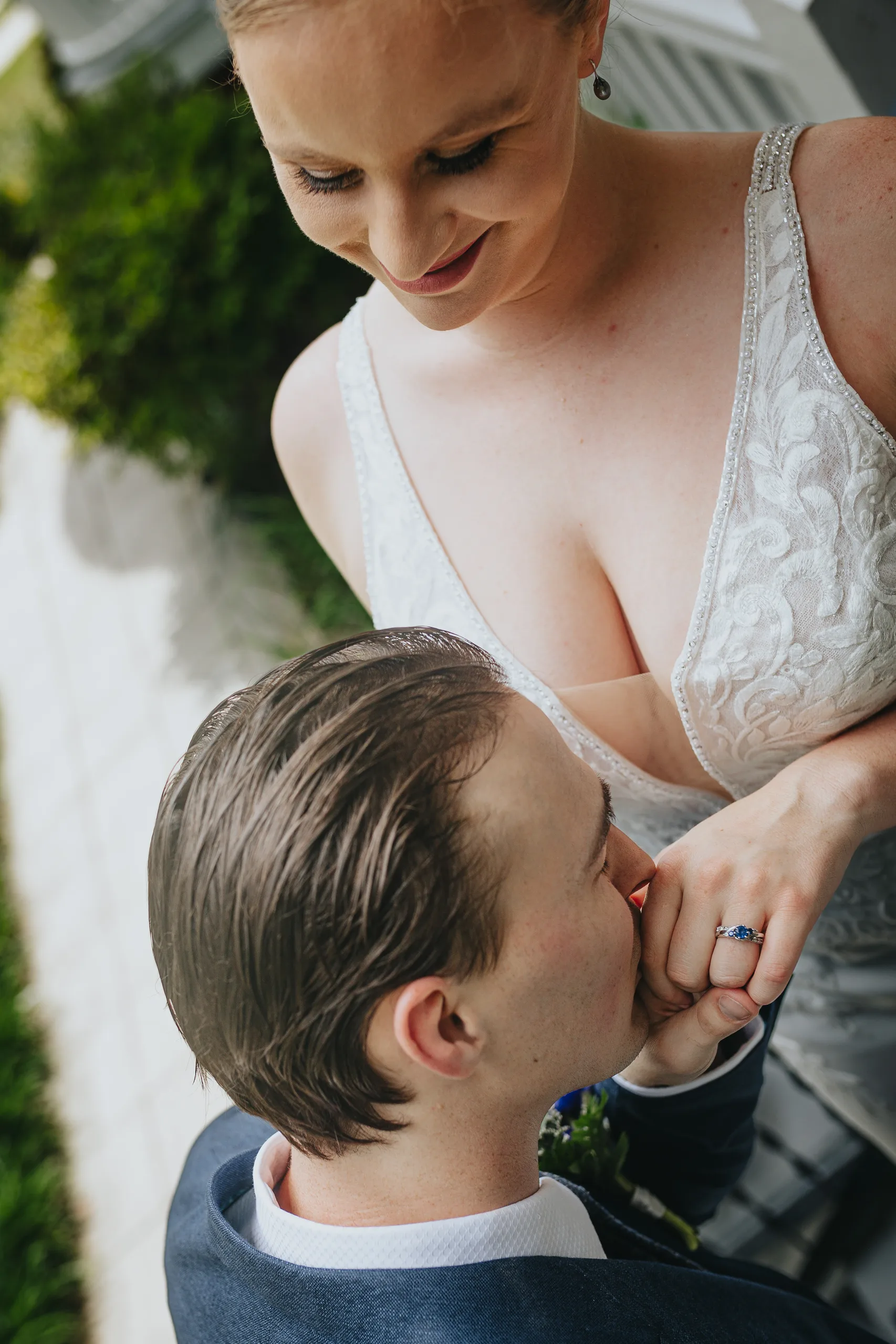 First Look: the groom kissing her hand, before their wedding at The Wildflower 301 in Greensboro, GA