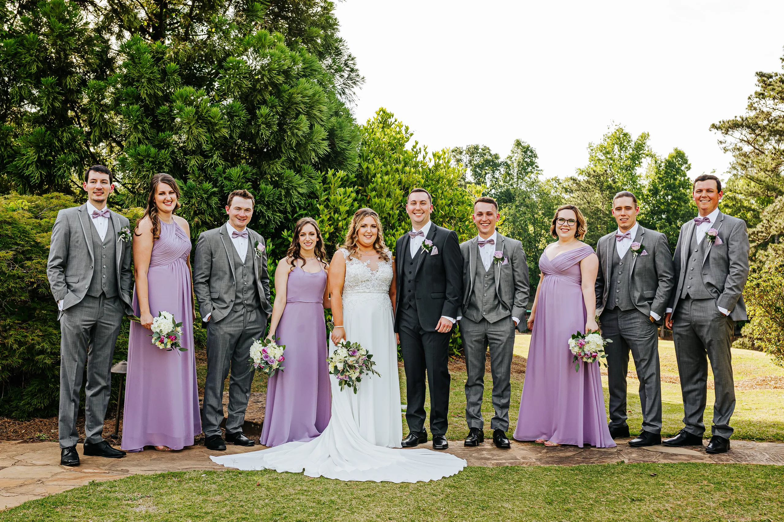 Wedding Party: the whole wedding party in lavender and grey at their wedding at the Country Club of Roswell in Roswell, GA