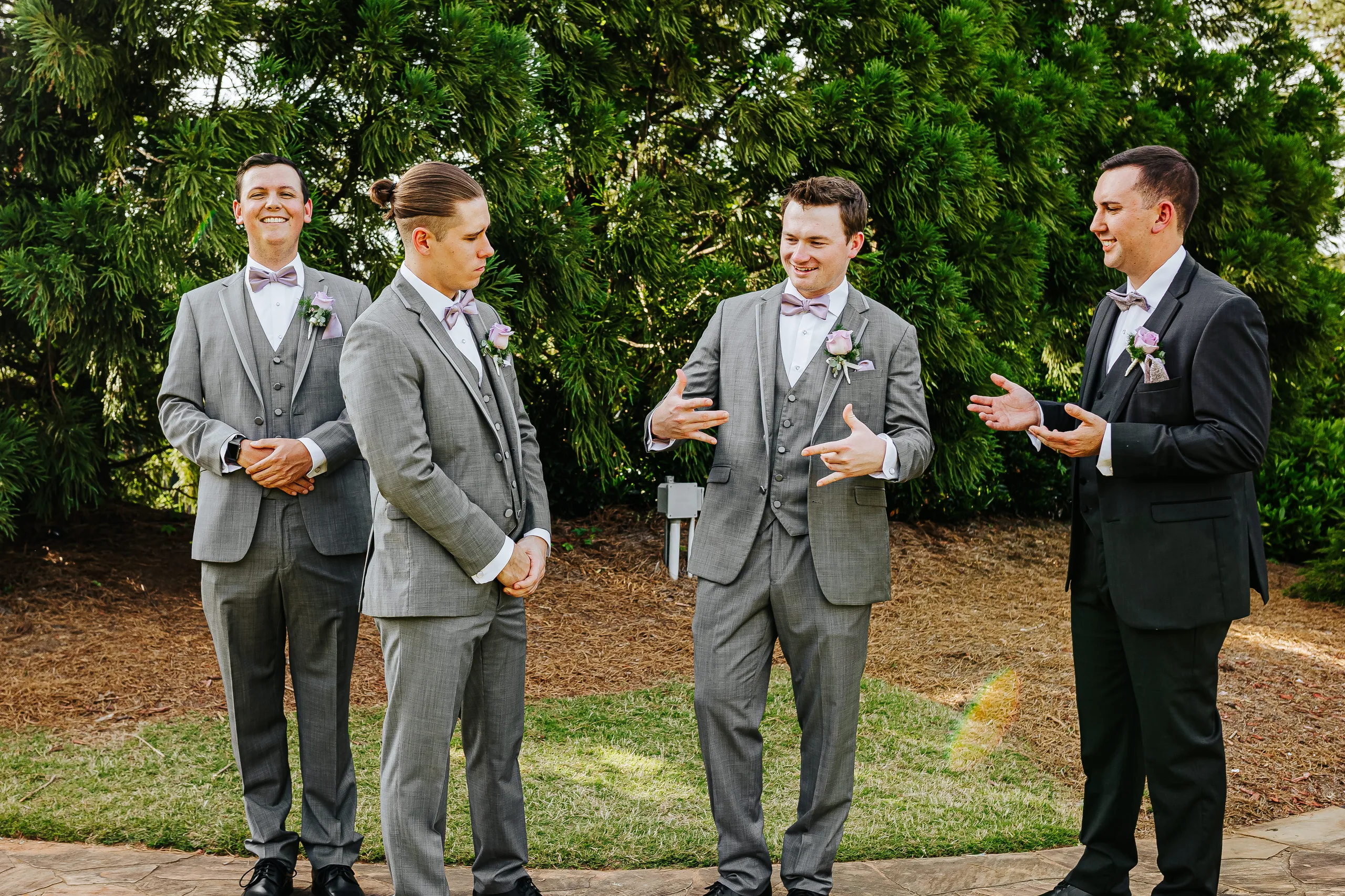 Wedding Party: the groomsmen joking around at their wedding at the Country Club of Roswell in Roswell, GA