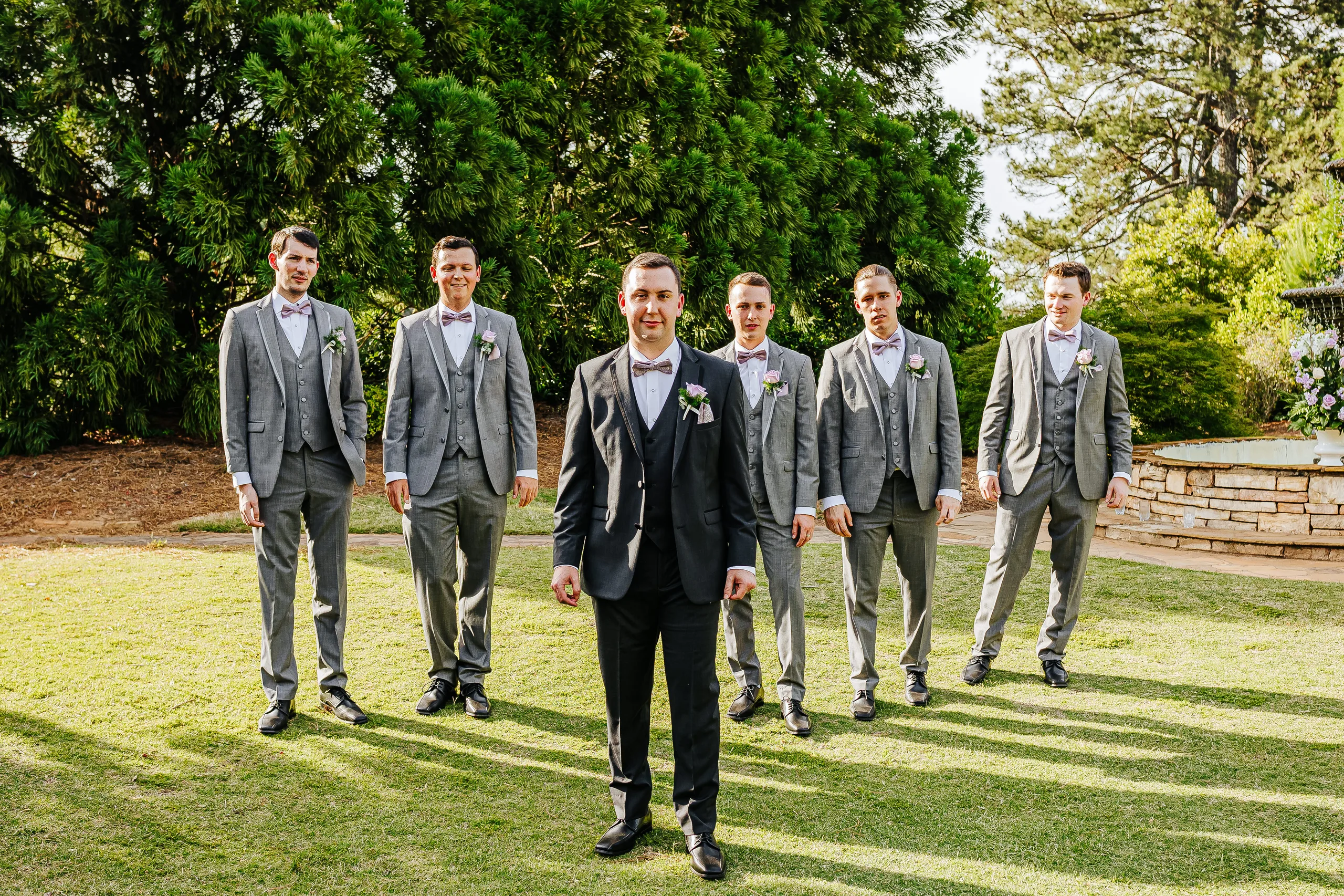 Wedding Party: the groom in front of his groomsmen at their wedding at the Country Club of Roswell in Roswell, GA