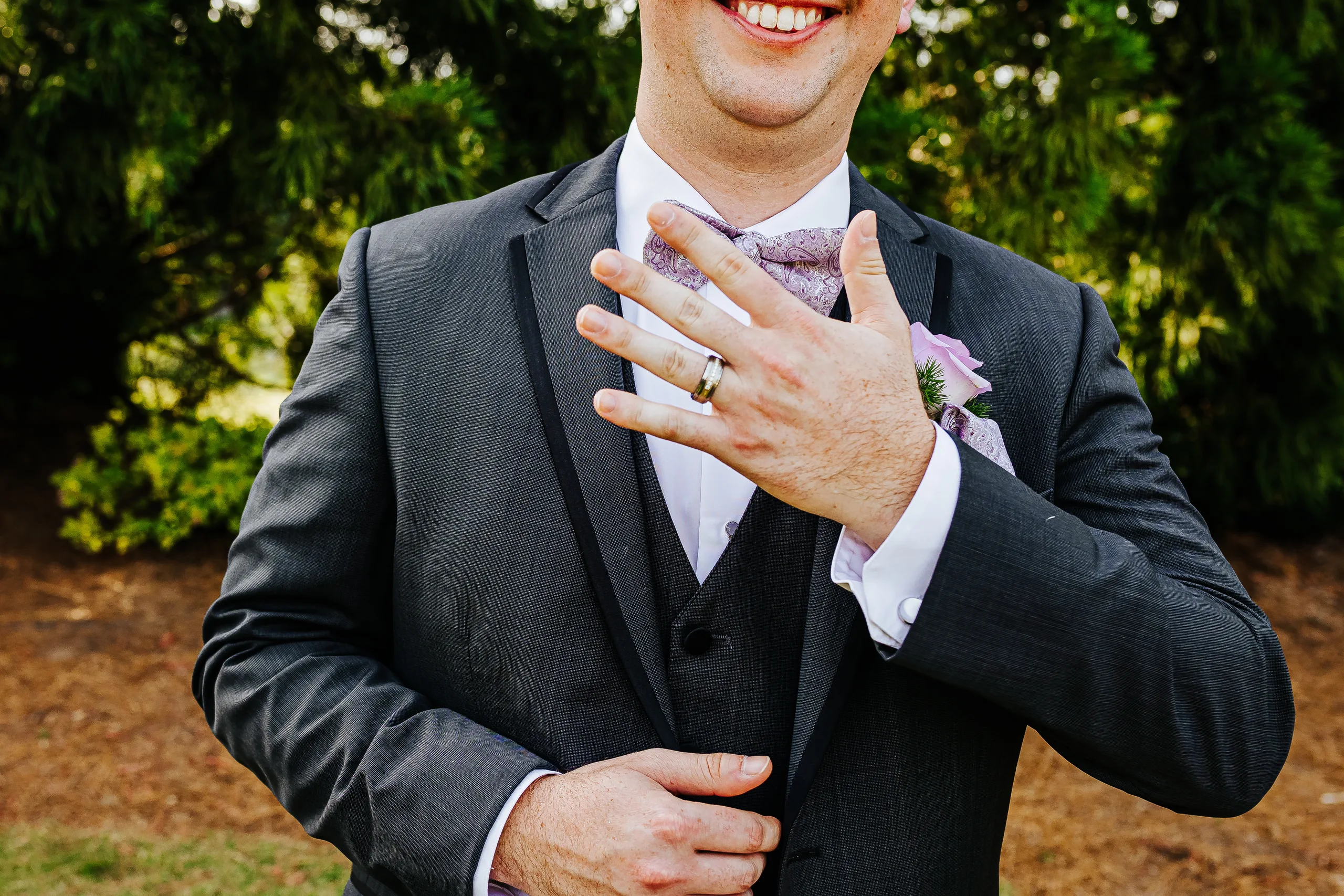 Wedding Formals: the groom showing off his ring at their wedding at the Country Club of Roswell in Roswell, GA