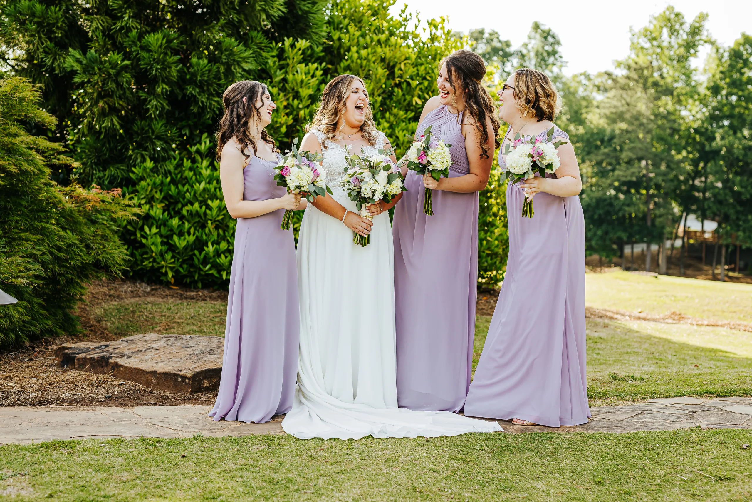 Wedding Party: the bride laughing with her bridesmaids at their wedding at the Country Club of Roswell in Roswell, GA