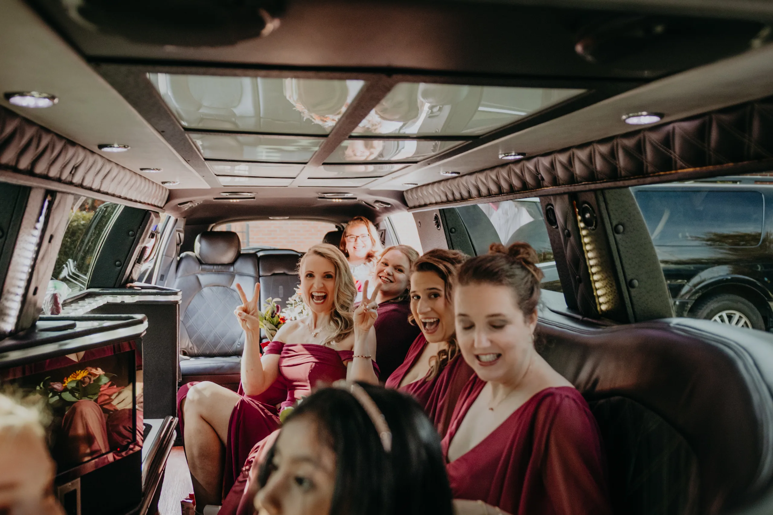 Wedding Party: the bridesmaids in the limo, before their wedding at St. Lawrence Catholic Church in Lawrenceville, GA