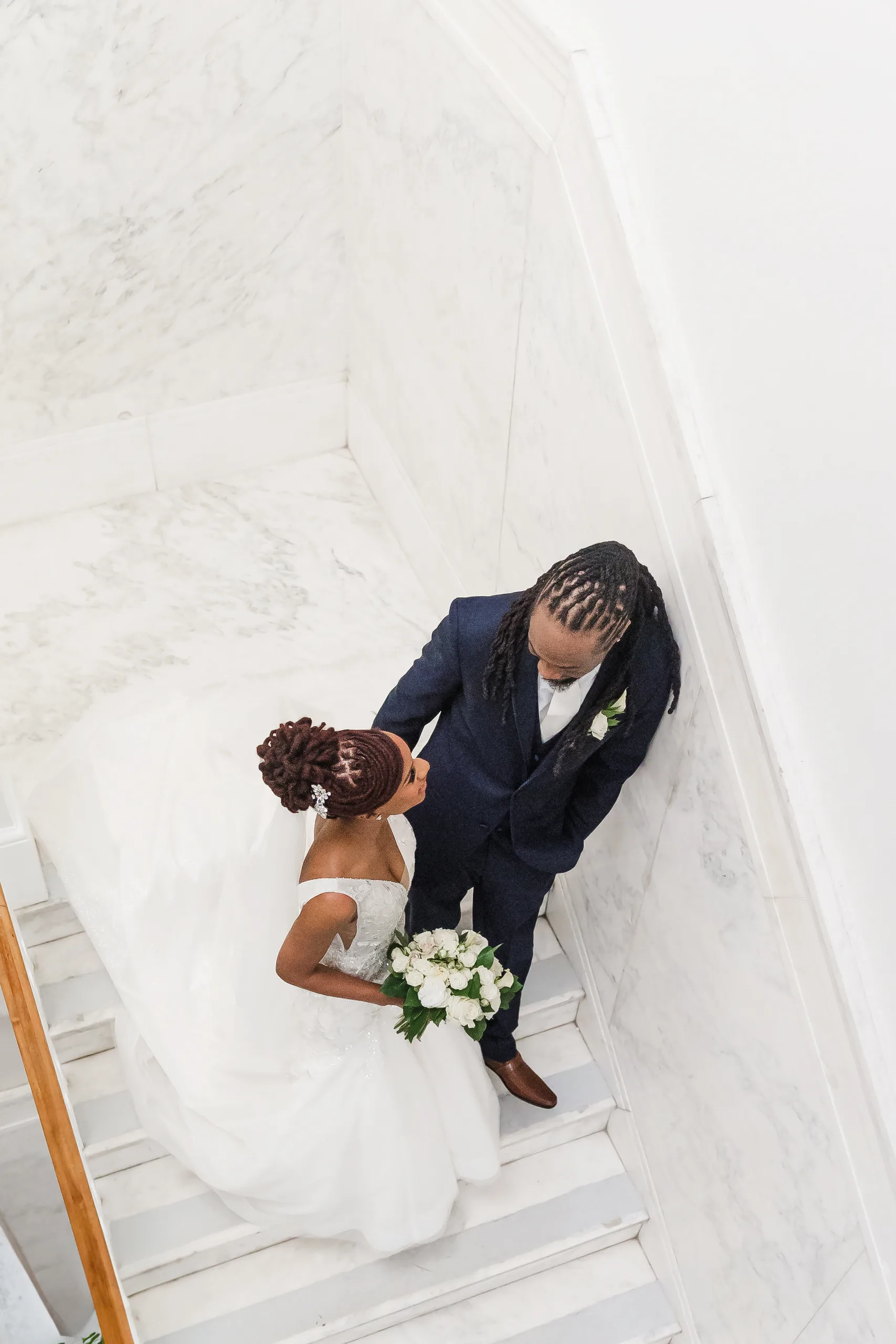 Wedding Formals: on the marble stairs from above, at their wedding at the Historic DeKalb Courthouse in Decatur, GA