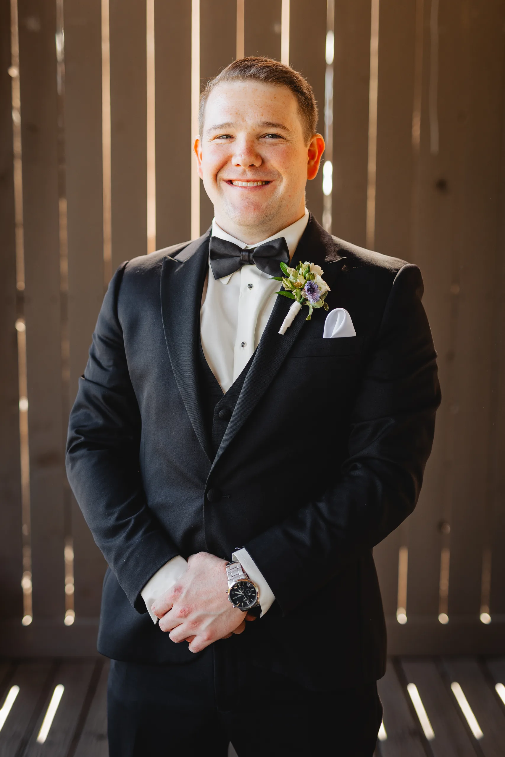 Getting Ready: the groom in his tux and bow tie before their wedding at Ivy Hall at Roswell Mill in Roswell, GA
