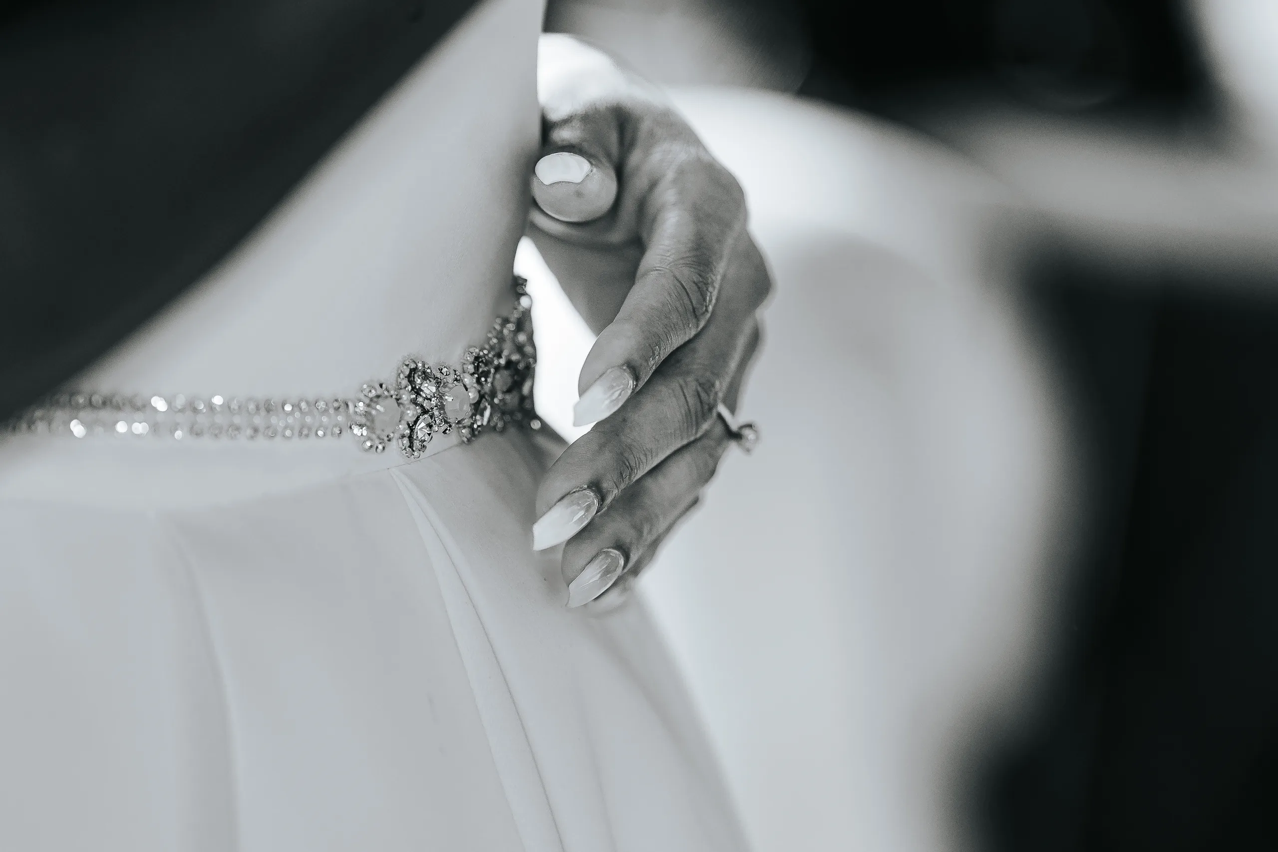 Bridal Portraits: her hand at the back of her beaded belt, in black and white, at their wedding at Terminus 330 in Atlanta, GA