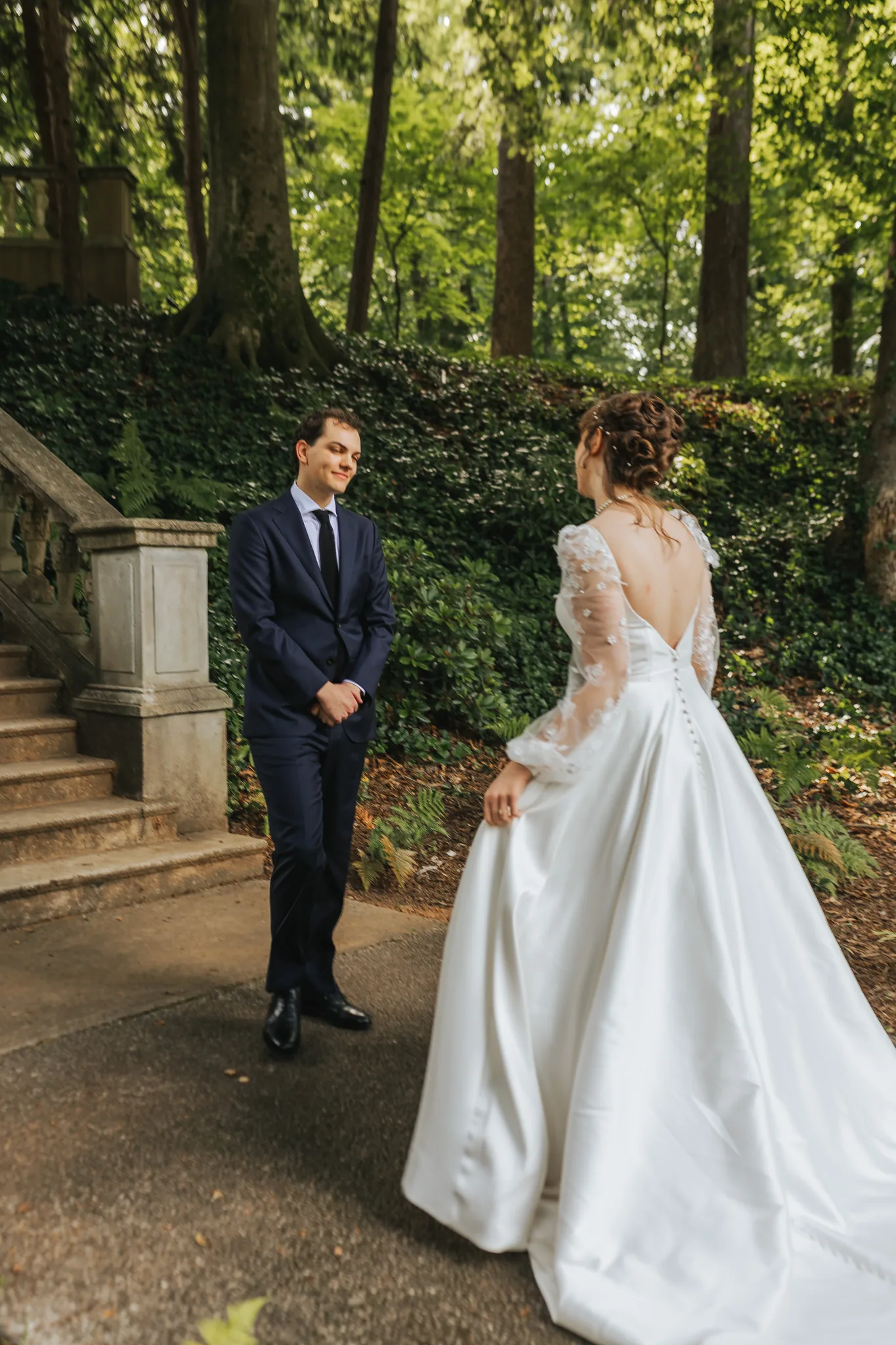 First Look: the groom turning to see the bride for the first time, on their wedding day at Cator Woolford Gardens in Atlanta, GA