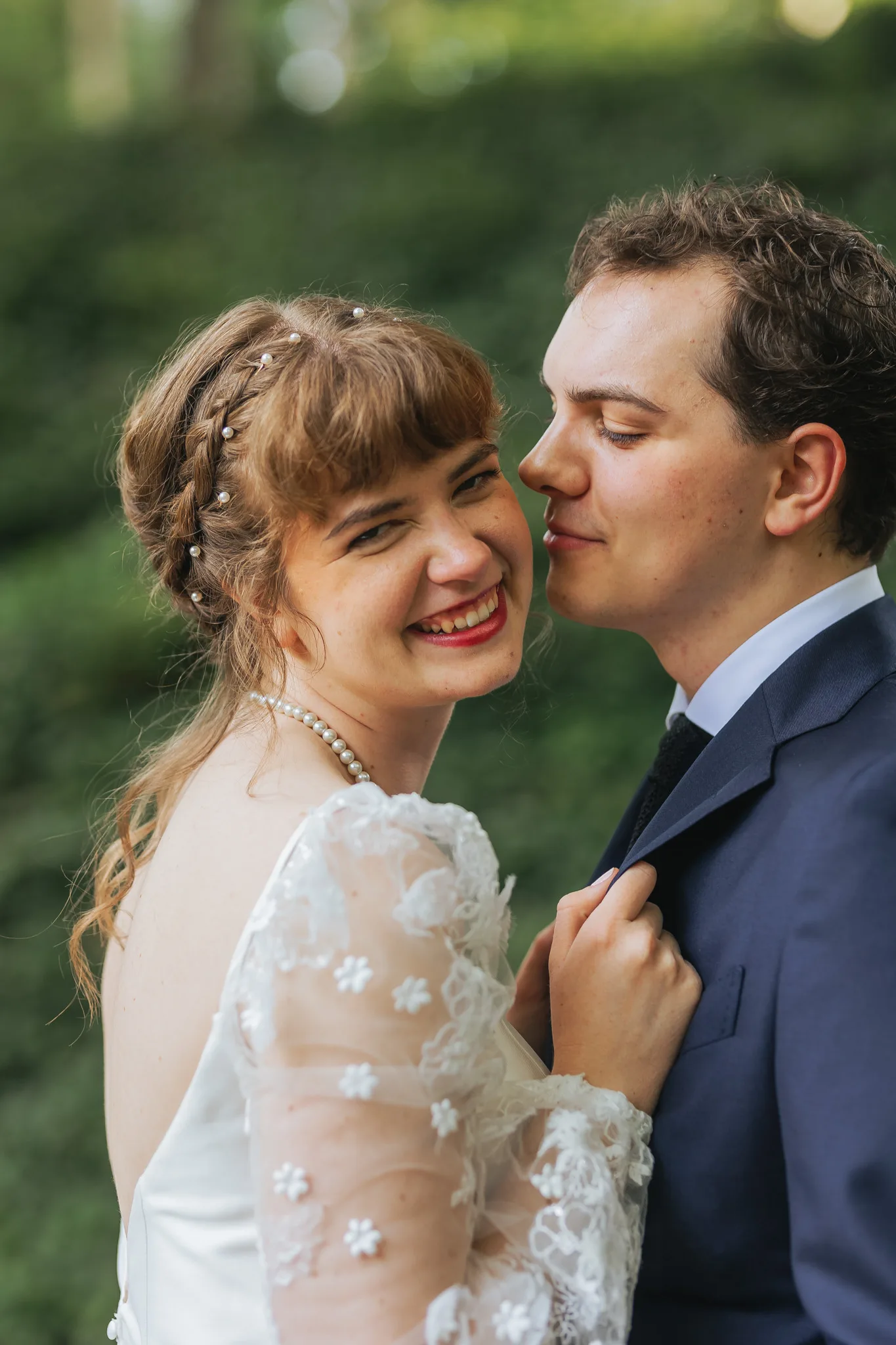 Wedding Formals: laughing close together in the garden, on their wedding day at Cator Woolford Gardens in Atlanta, GA
