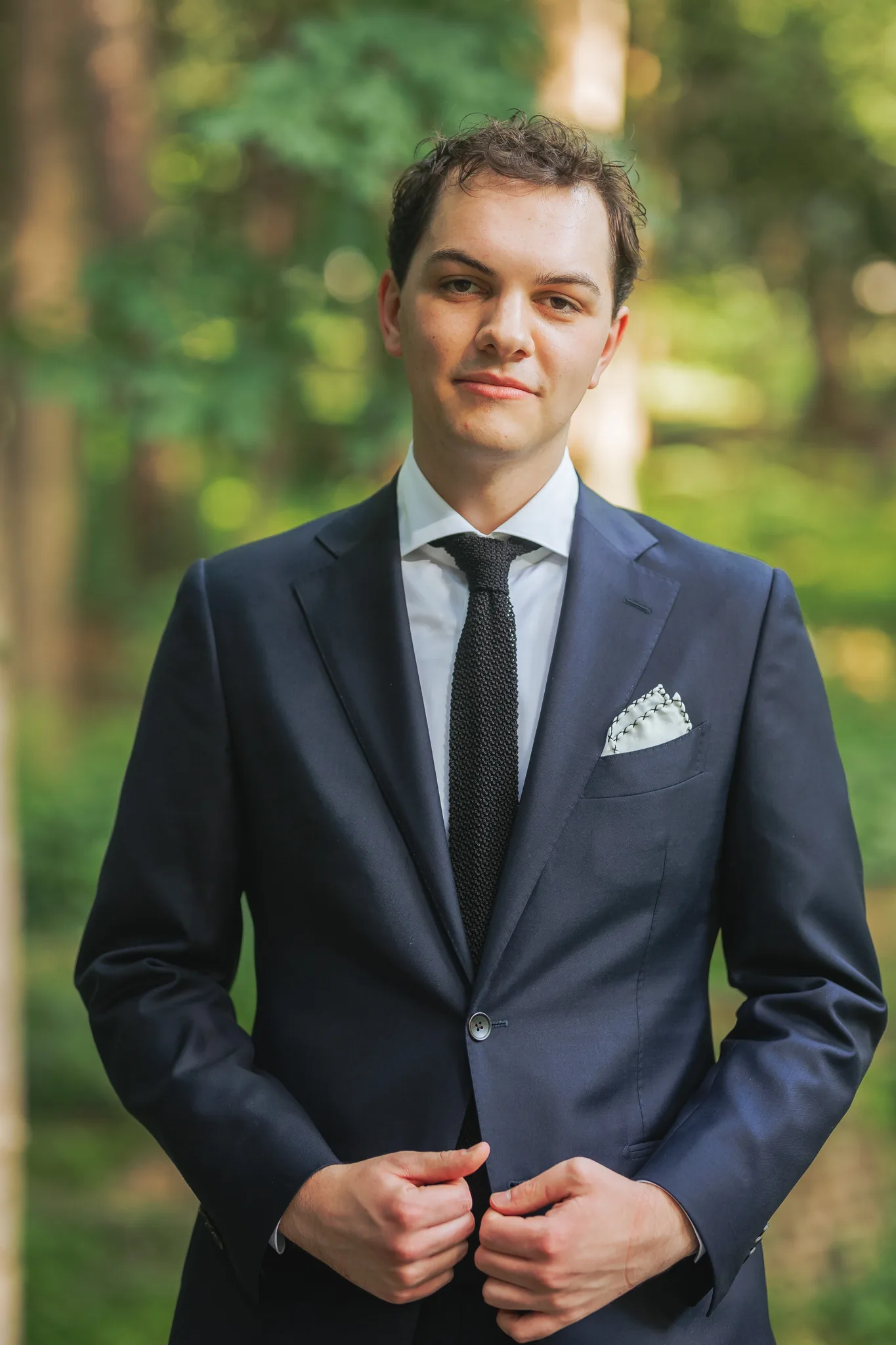 Wedding Formals: the groom in his navy suit in the woods, on their wedding day at Cator Woolford Gardens in Atlanta, GA