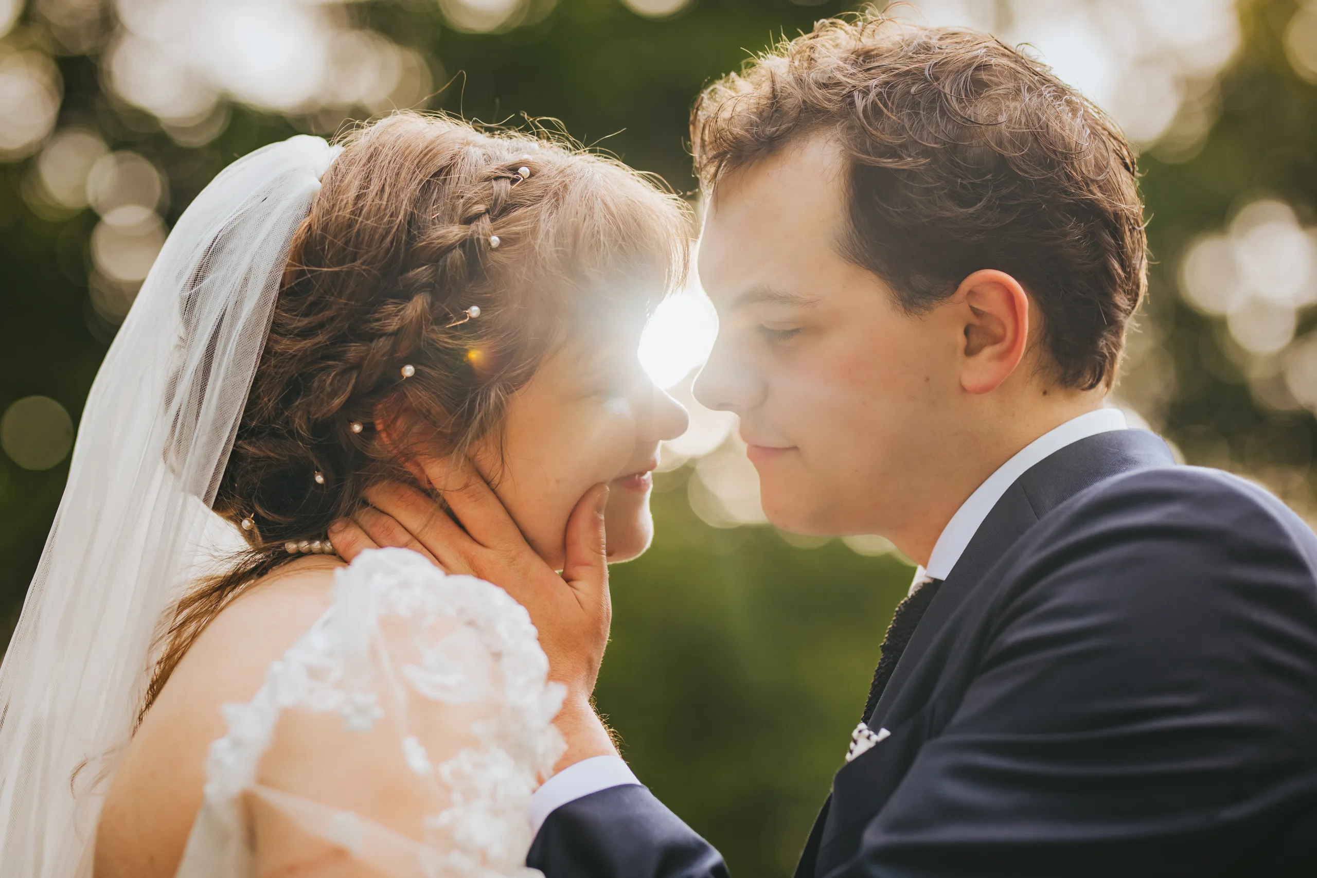 Wedding Formals: face to face with the sun behind them, on their wedding day at Cator Woolford Gardens in Atlanta, GA