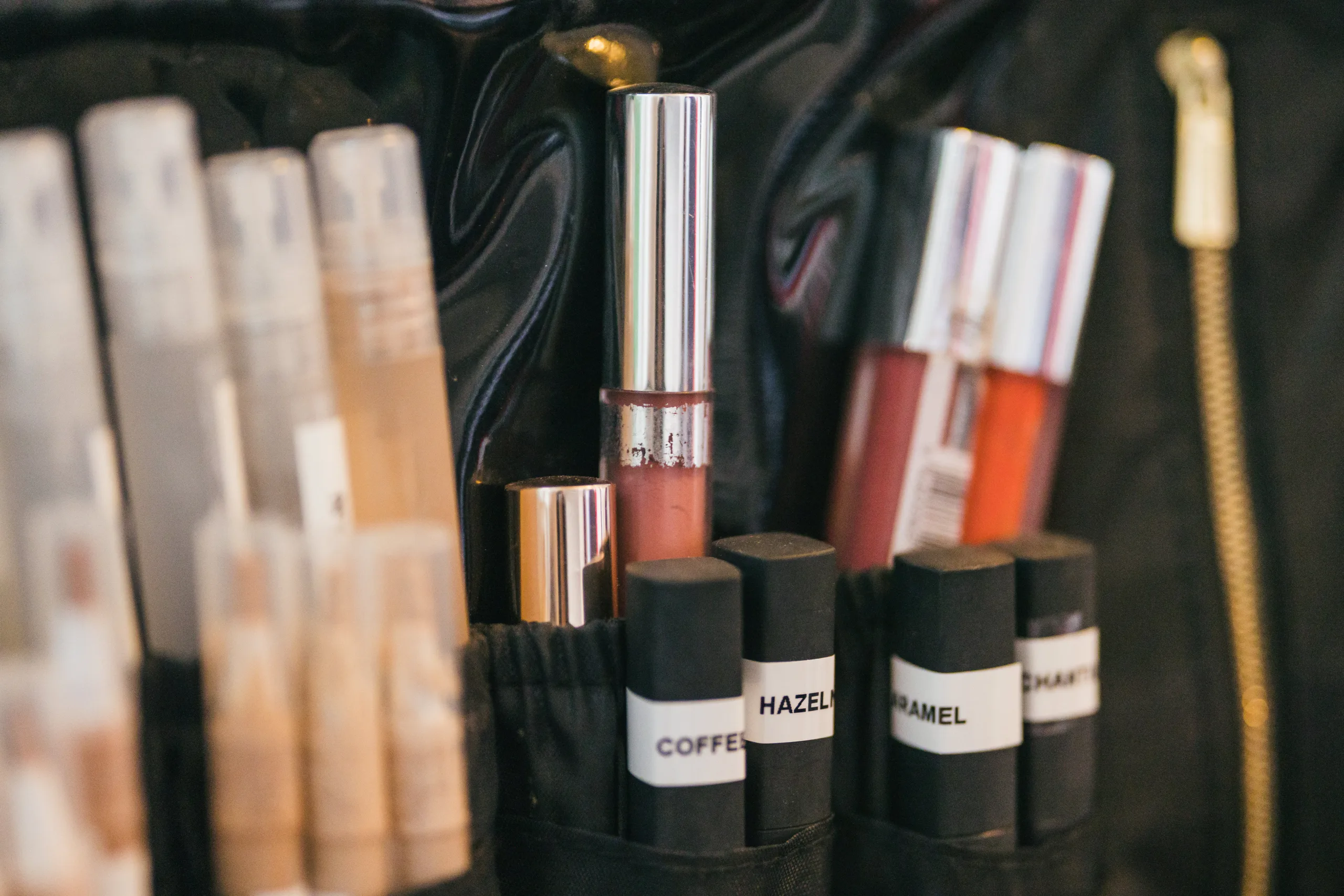 Getting Ready: lipsticks and foundation in the makeup kit before their wedding at the Payne-Corley House in Duluth, GA