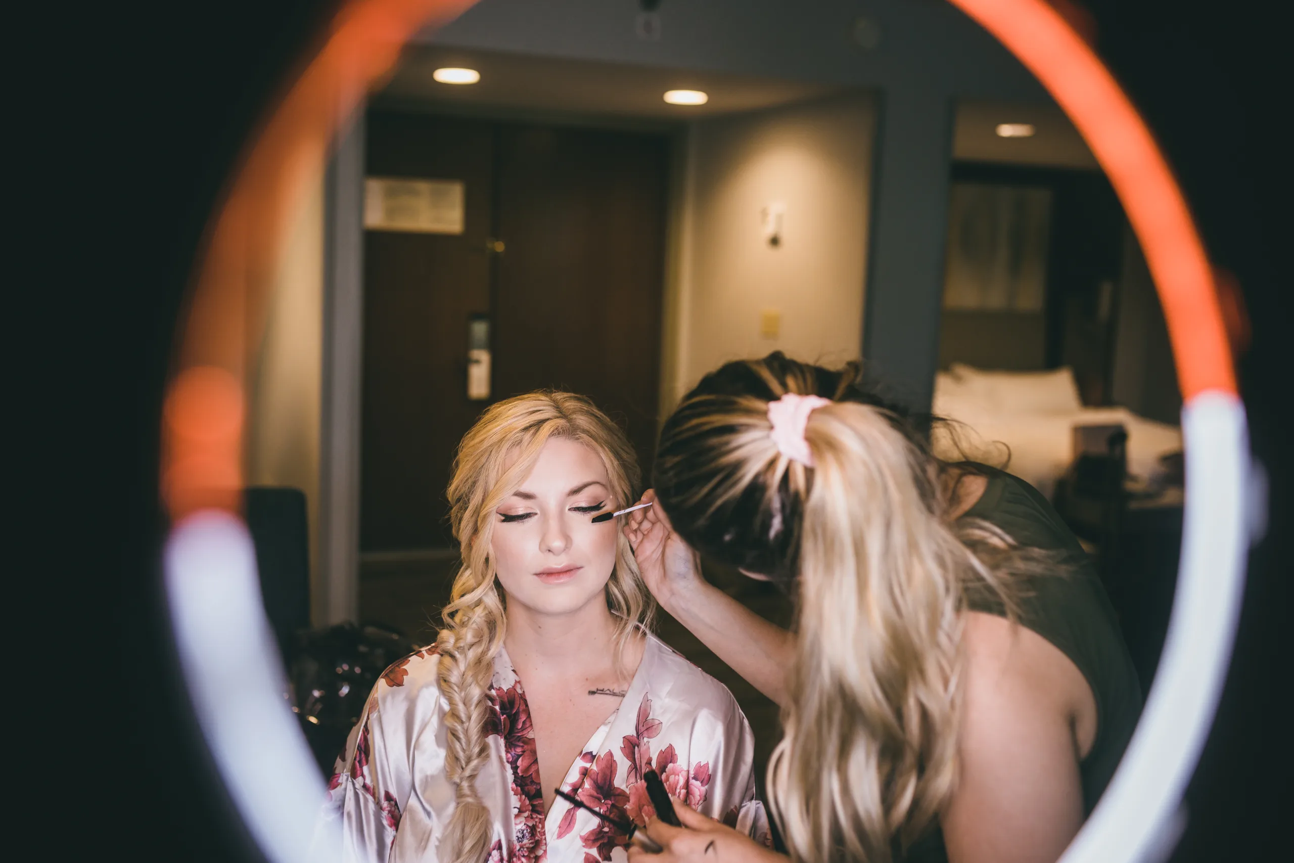 Getting Ready: the bride's makeup seen through a ring light, before their wedding at Atlanta Evergreen Lakeside Resort in Stone Mountain, GA