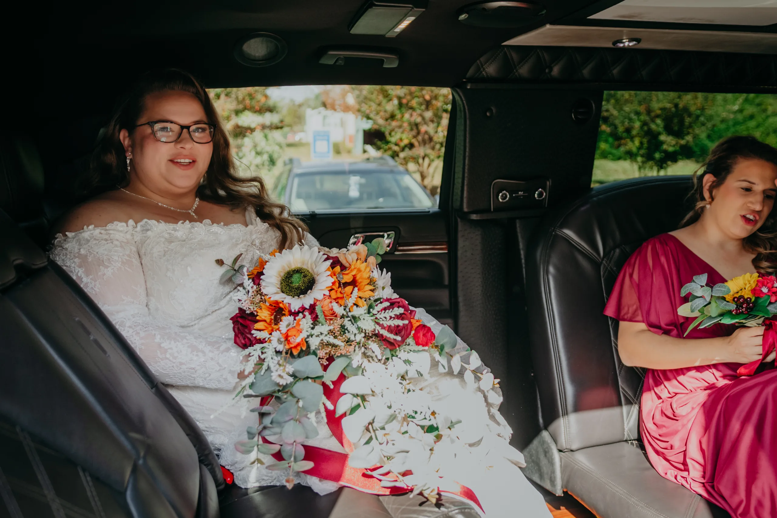 Getting Ready: the bride in the limo with her bouquet, before their wedding at St. Lawrence Catholic Church in Lawrenceville, GA