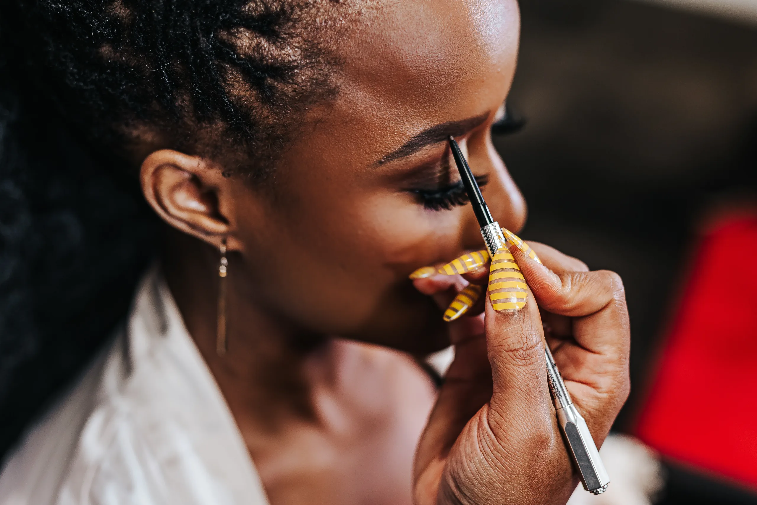 Getting Ready: the bride's lashes being done, before their wedding at Terminus 330 in Atlanta, GA