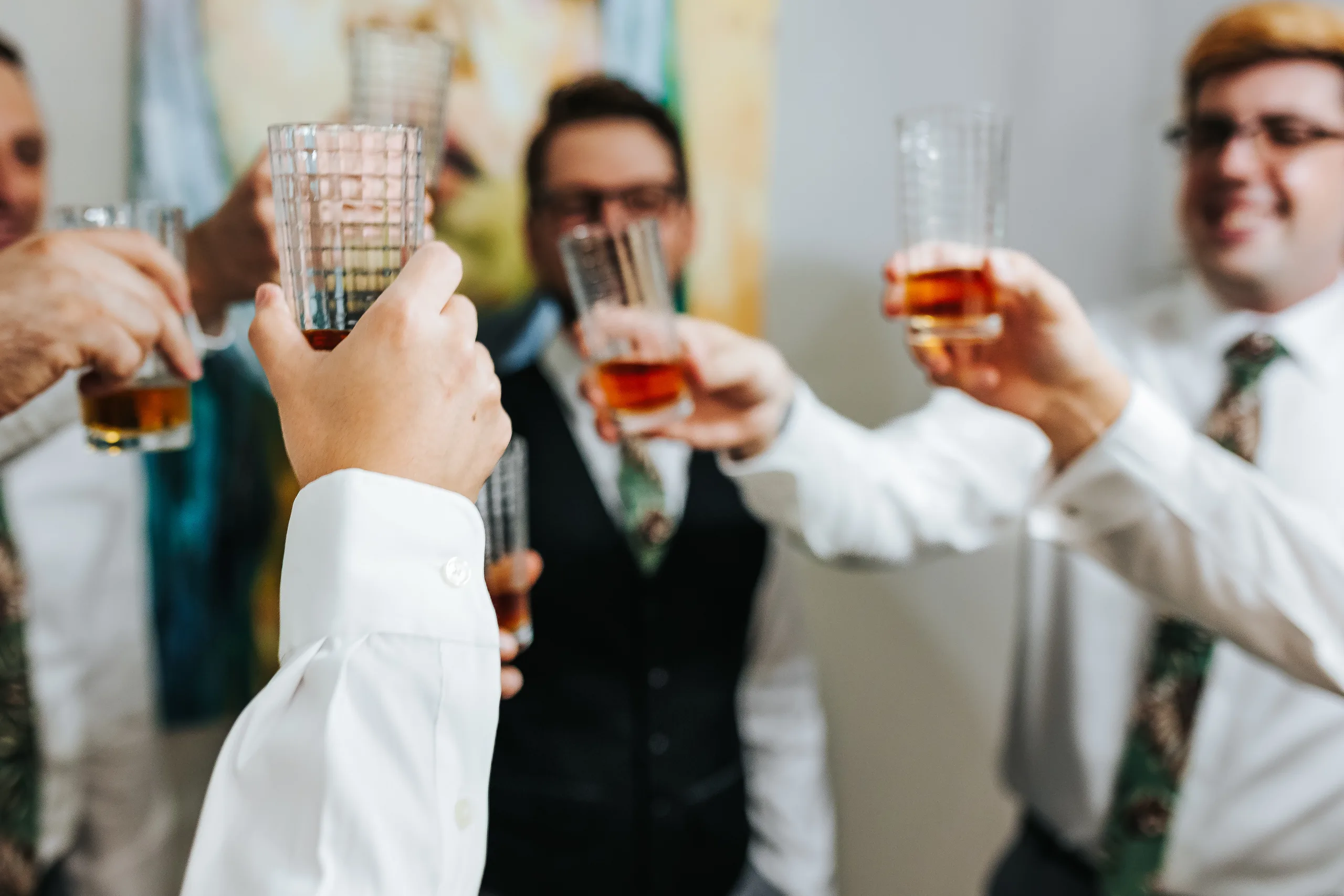 Getting Ready: the groom and his groomsmen raising a toast, before their wedding at Terminus 330 in Atlanta, GA