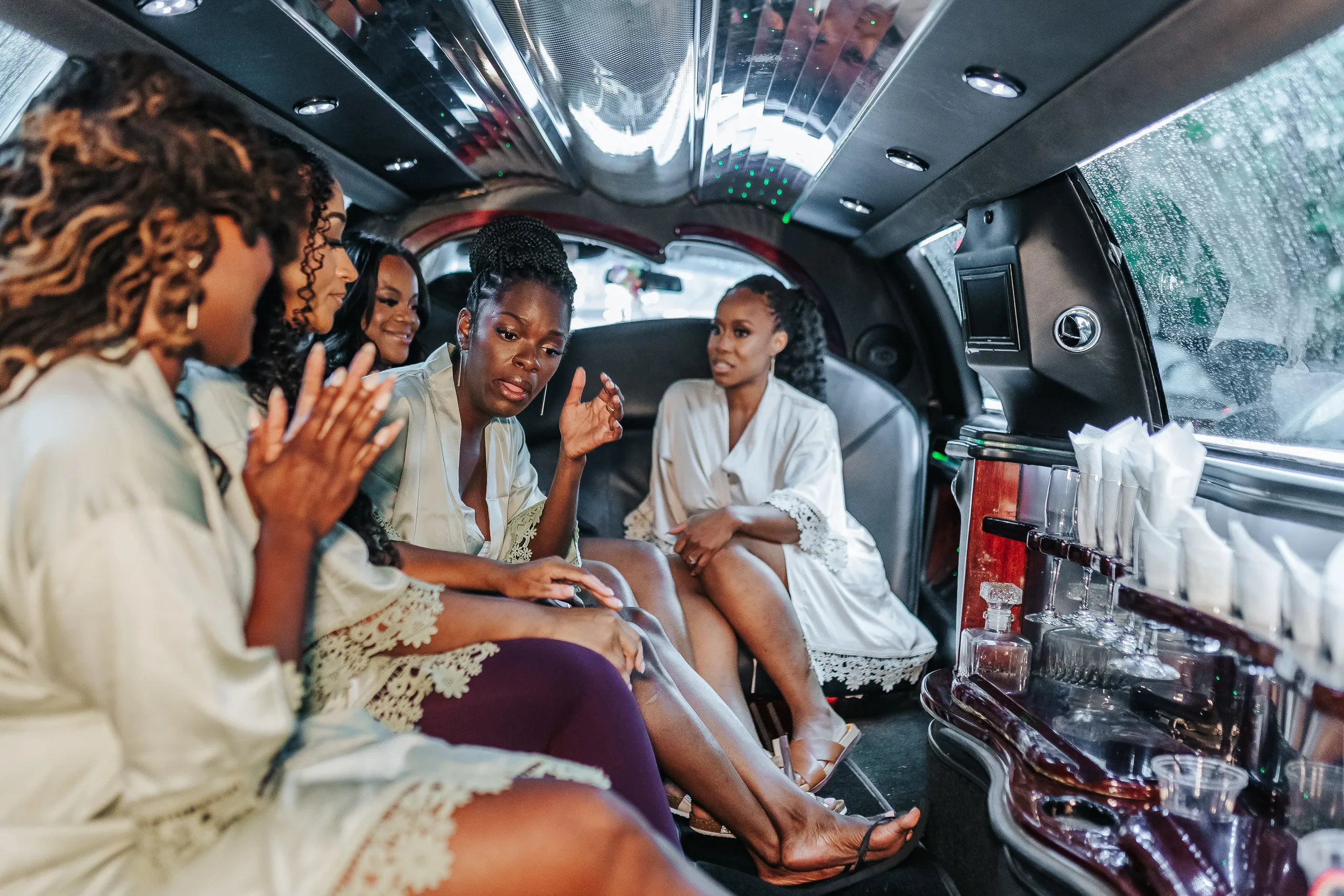 Getting Ready: the bride and her bridesmaids in the limo, before their wedding at Terminus 330 in Atlanta, GA