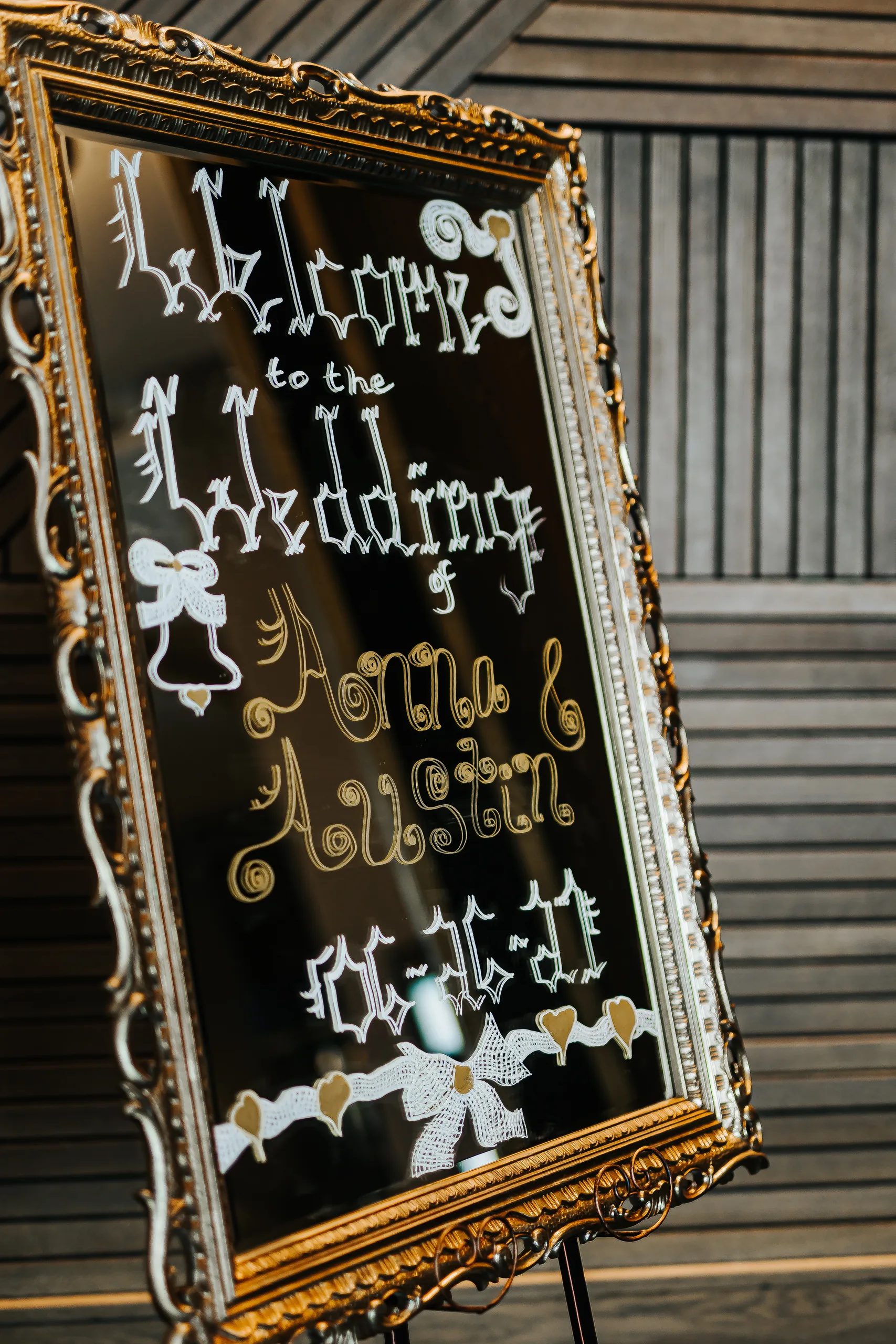 Wedding Details: the mirror welcome sign for Anna and Austin at a wedding at the Omni Hotel at The Battery in Atlanta, GA