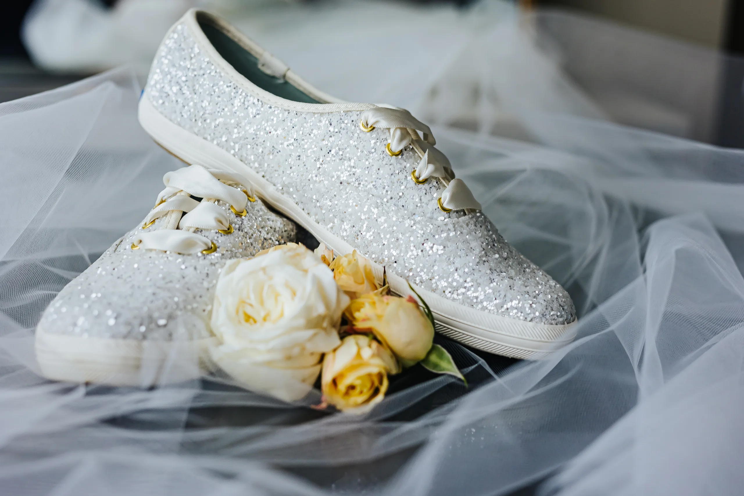 Wedding Details: the rings, shoes and veil laid out together at a wedding at the Omni Hotel at The Battery in Atlanta, GA