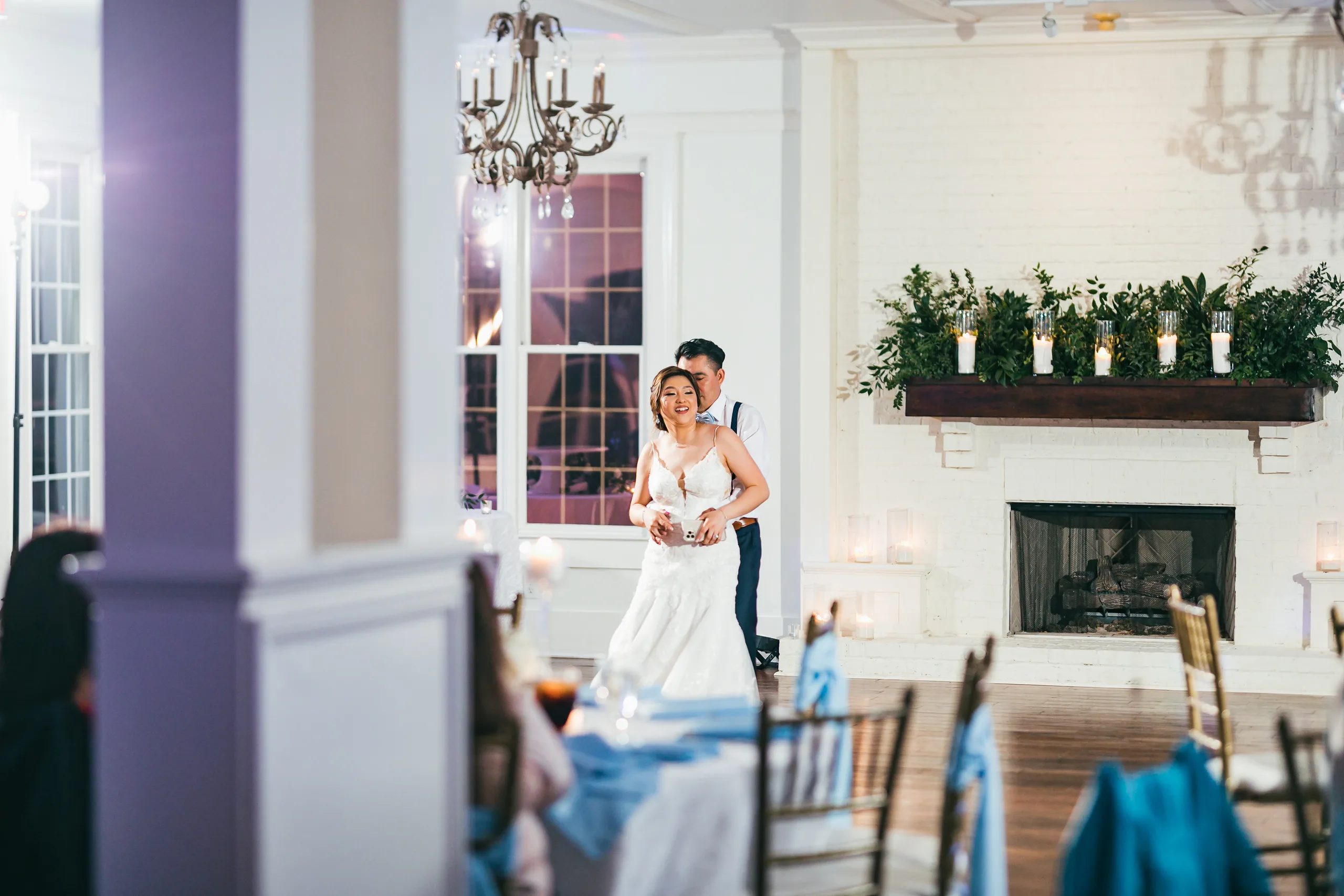 Reception: dancing by the fireplace at their wedding at the Payne-Corley House in Duluth, GA