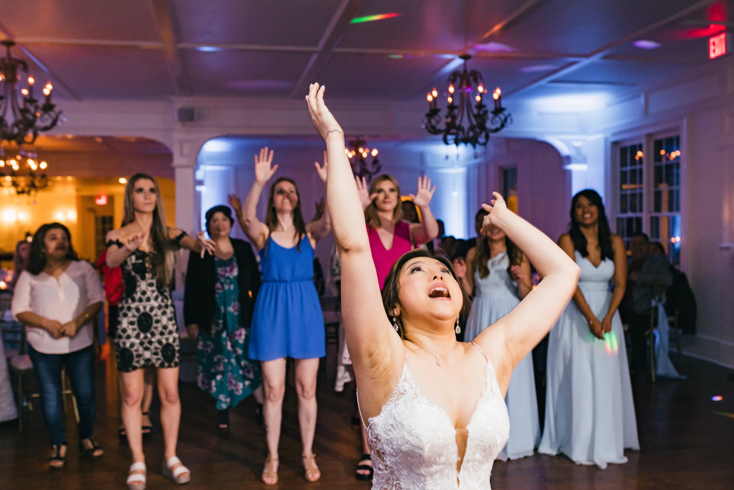 Reception: the bride tossing her bouquet at their wedding at the Payne-Corley House in Duluth, GA