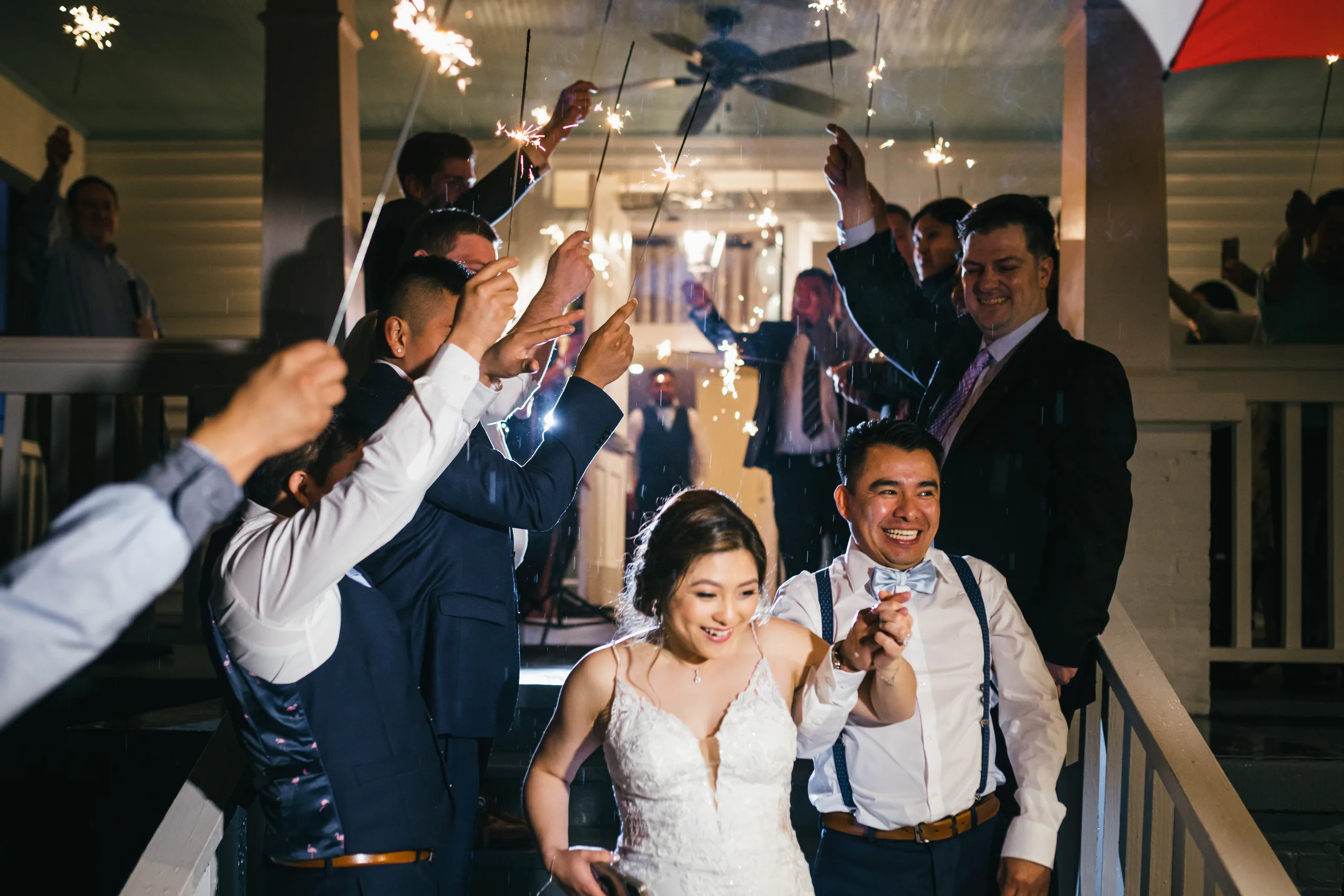Send-Off: laughing through the sparklers on the porch at their wedding at the Payne-Corley House in Duluth, GA
