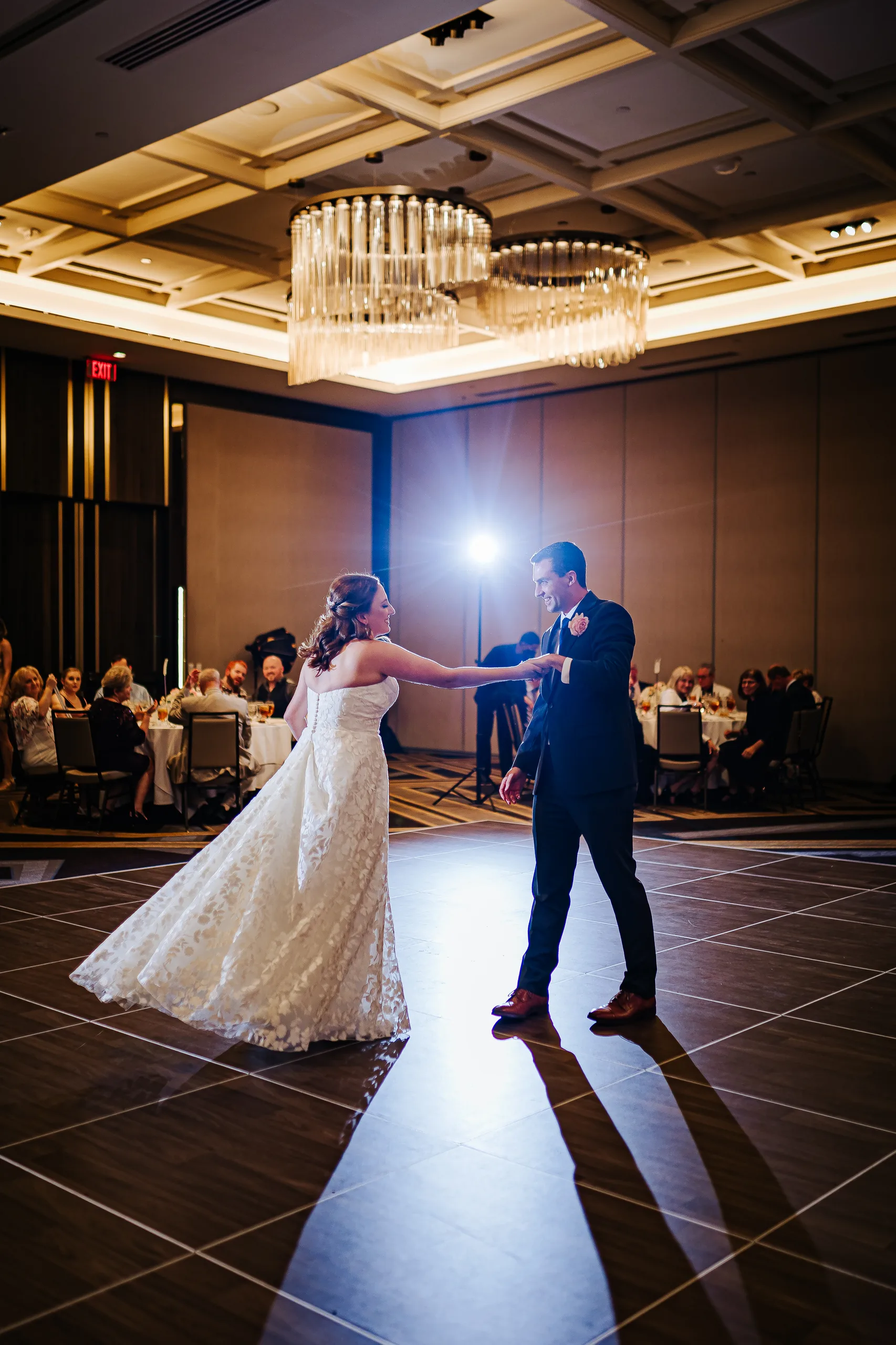 First Dance: a spin during their first dance at their wedding at the Omni Hotel at The Battery in Atlanta, GA