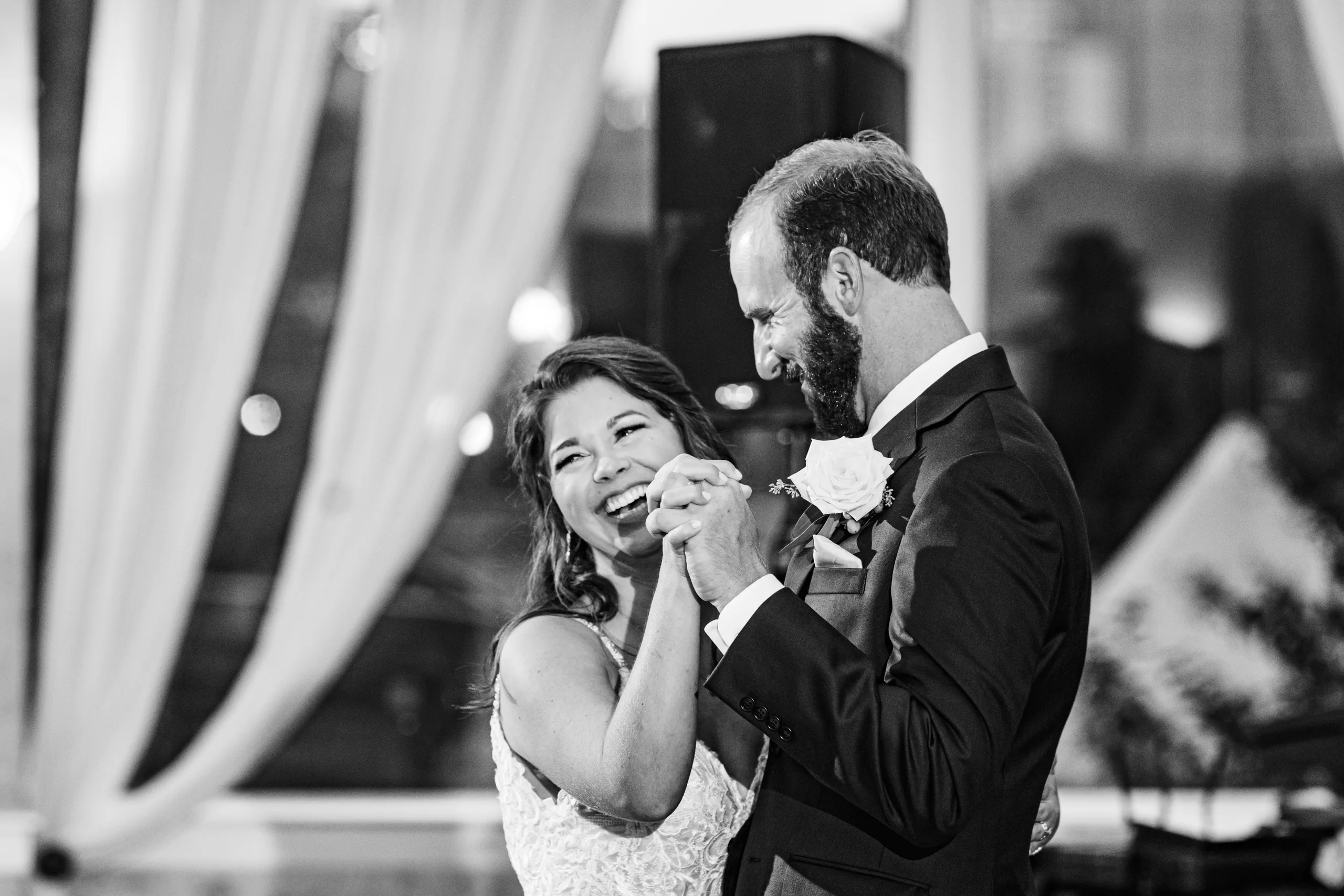 First Dance: laughing during their first dance, in black and white, at their wedding at The Piedmont Room in Atlanta, GA
